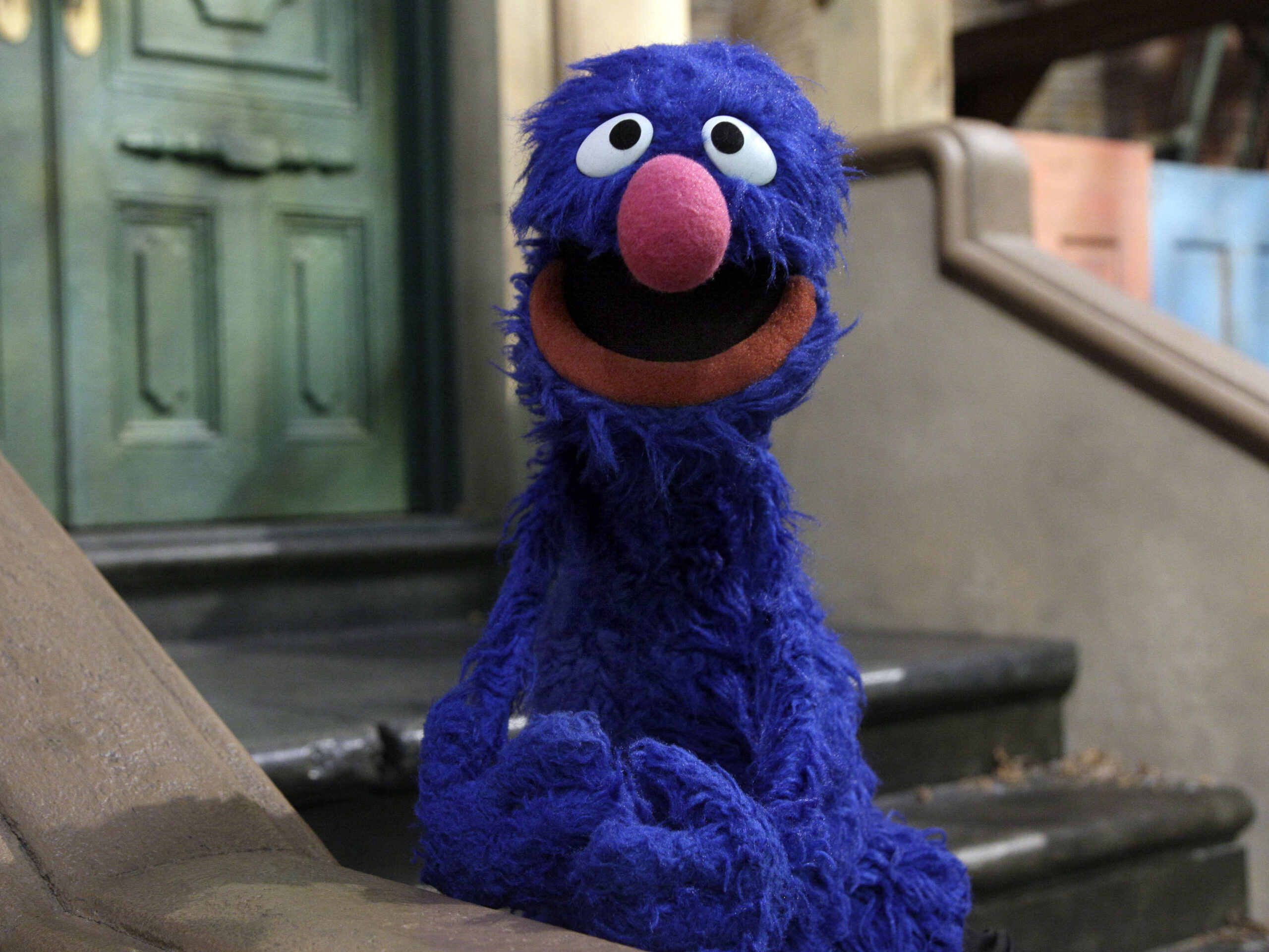Grover the Muppet says he’s a reporter. Not for long, joke his beleaguered peers