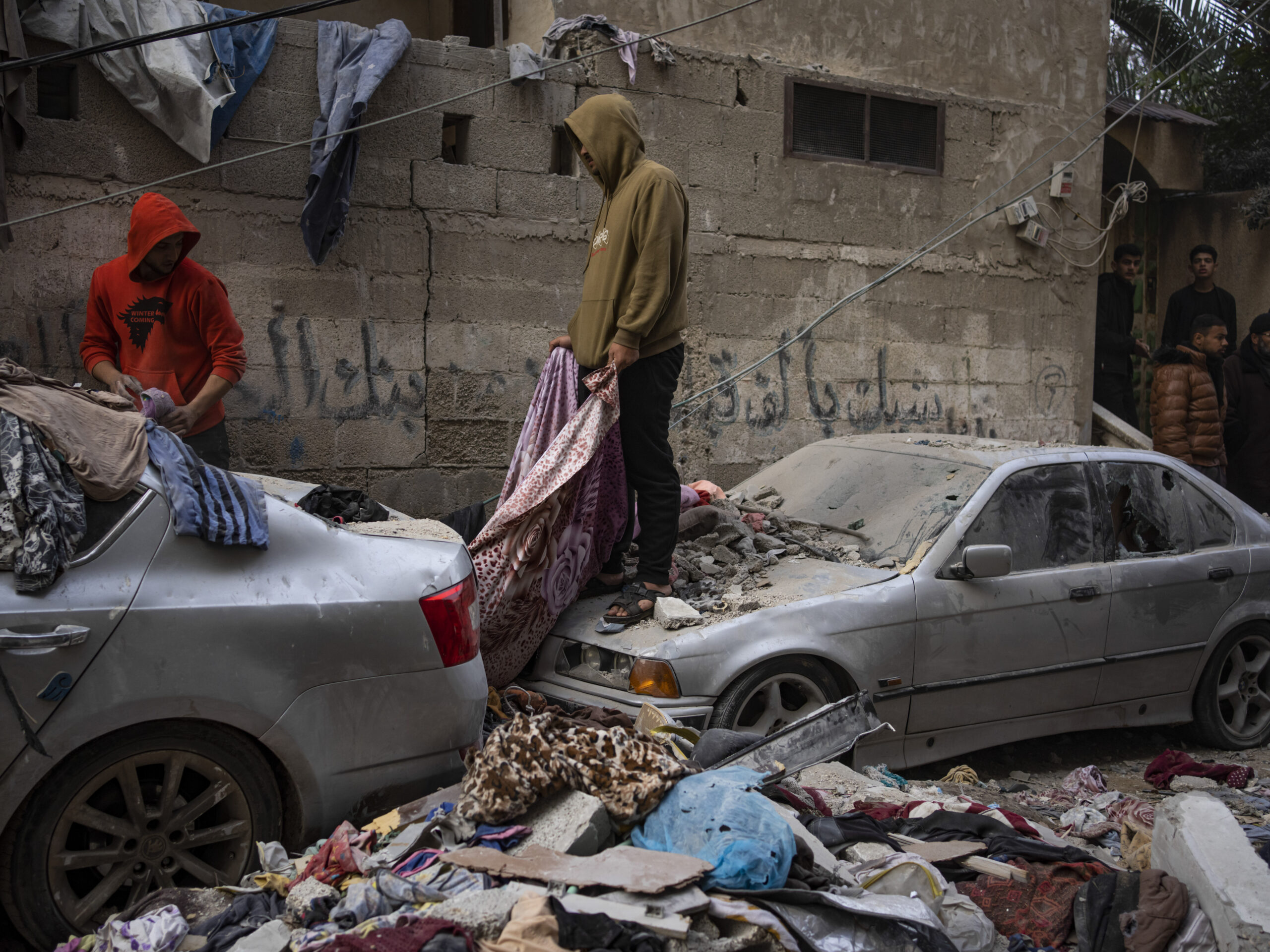Palestinians survey the destruction from an Israeli airstrike in Rafah, Gaza, on Friday, Feb. 9.