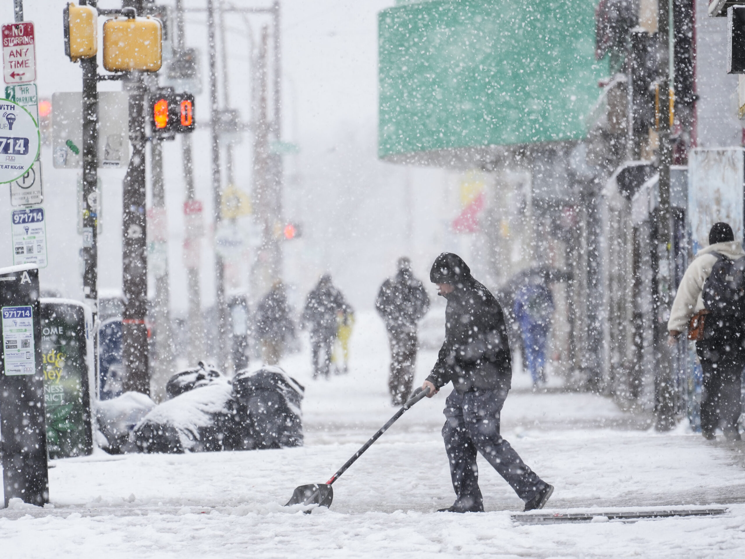 A rapidly moving winter storm disrupts travel and closes schools in the Northeast