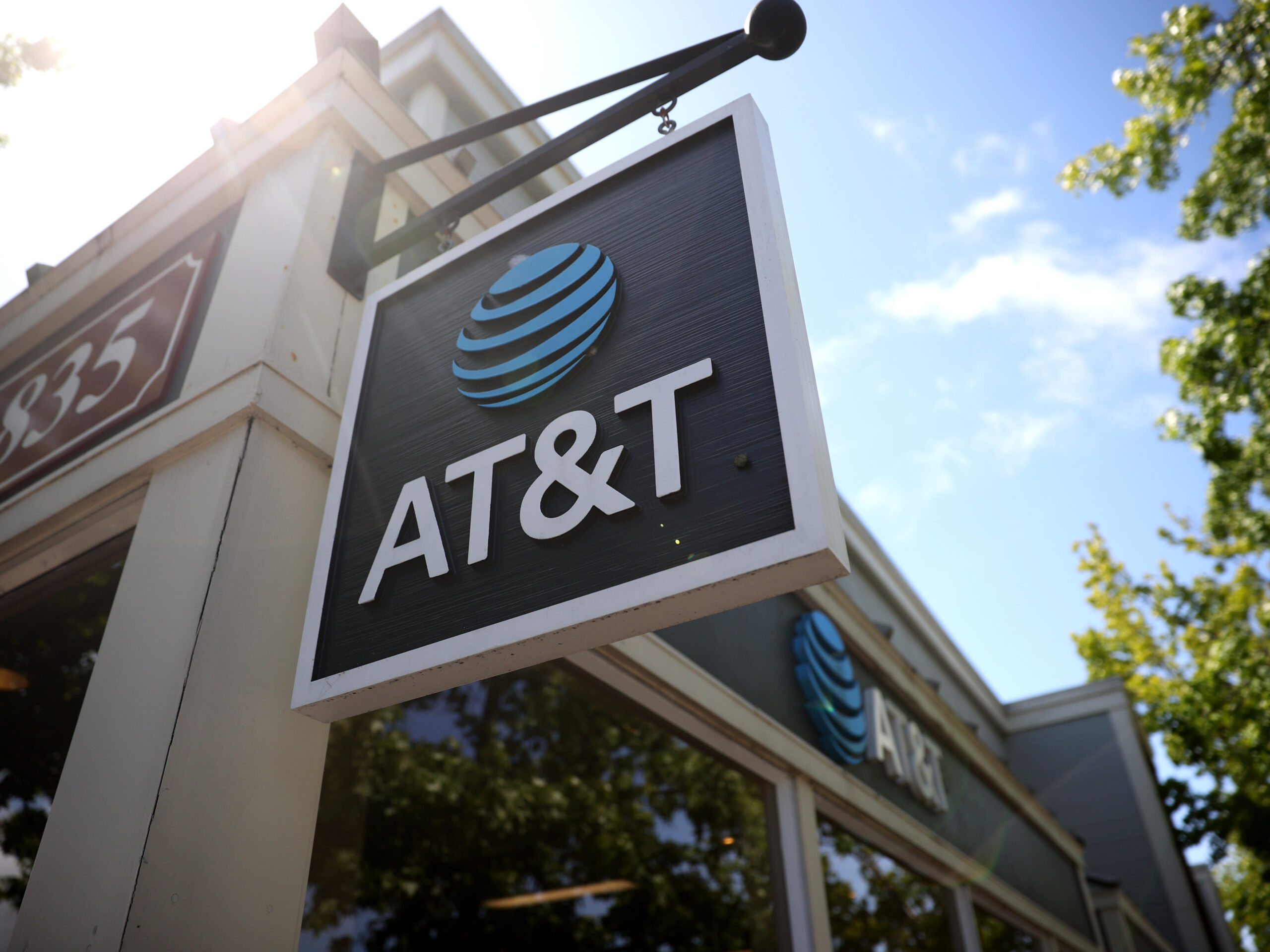 A sign is posted in front of an AT&T retail store in 2021 in San Rafael, Calif.