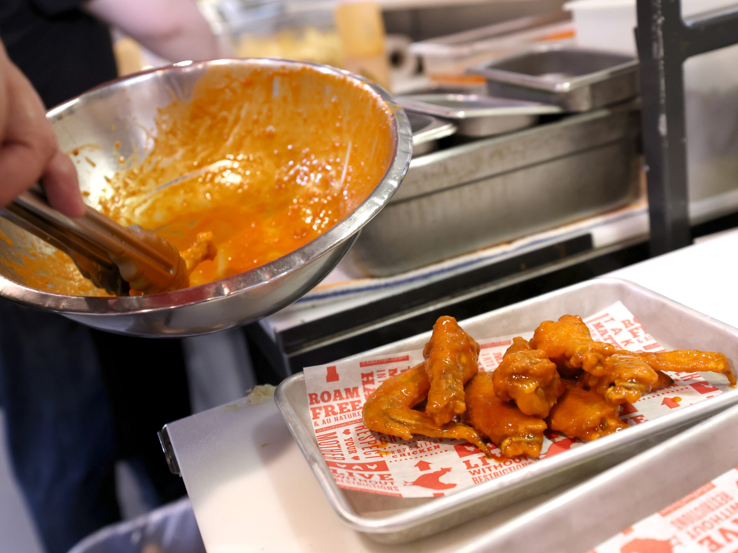 Good thing, wings cost less and beer’s flat: Super Bowl fans are expected to splurge