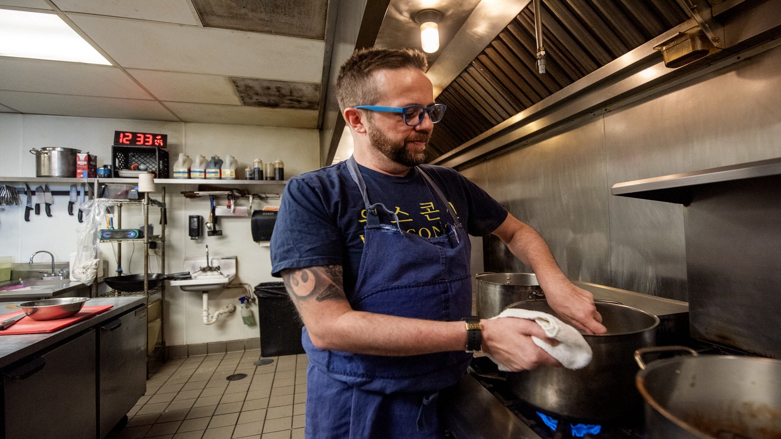 Dan Jacobs stirs a pot on the stove.
