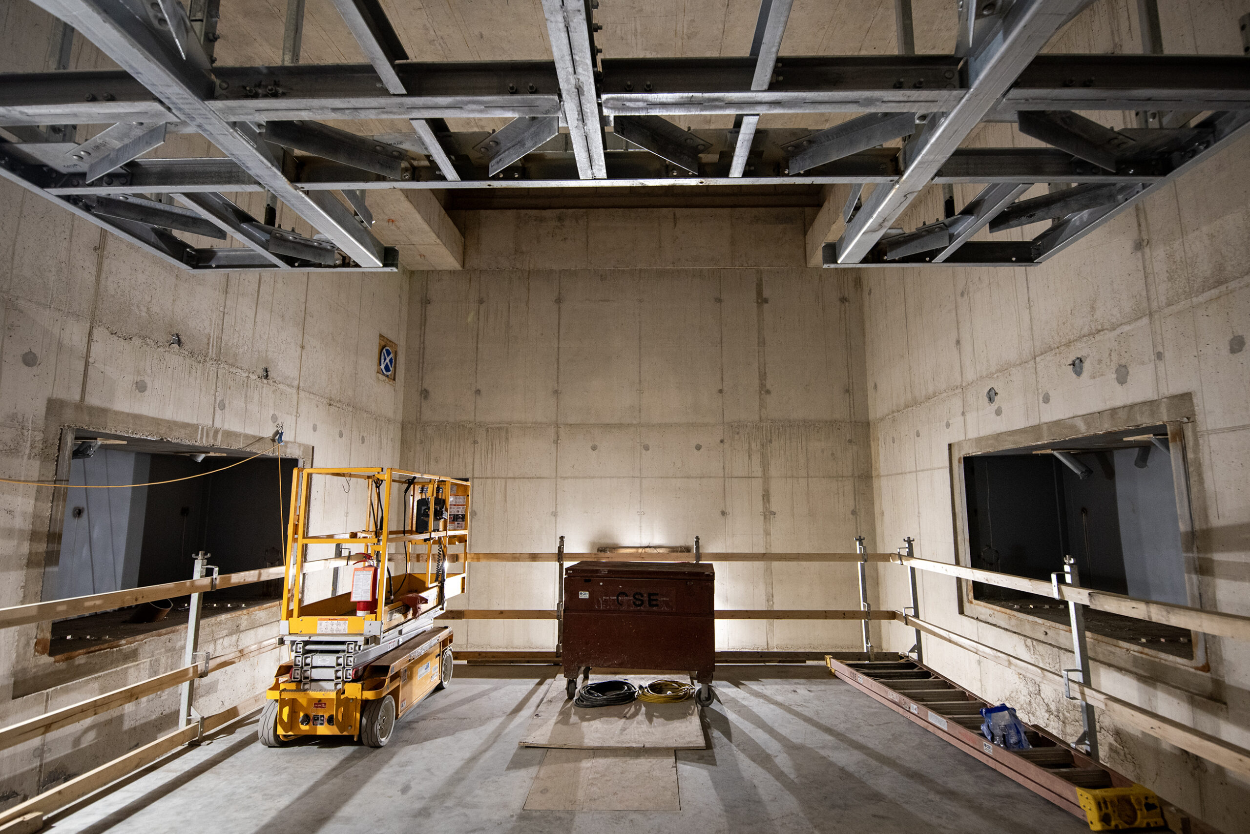 Concrete walls with rectangular spaces in the side for scanning equipment is under construction.