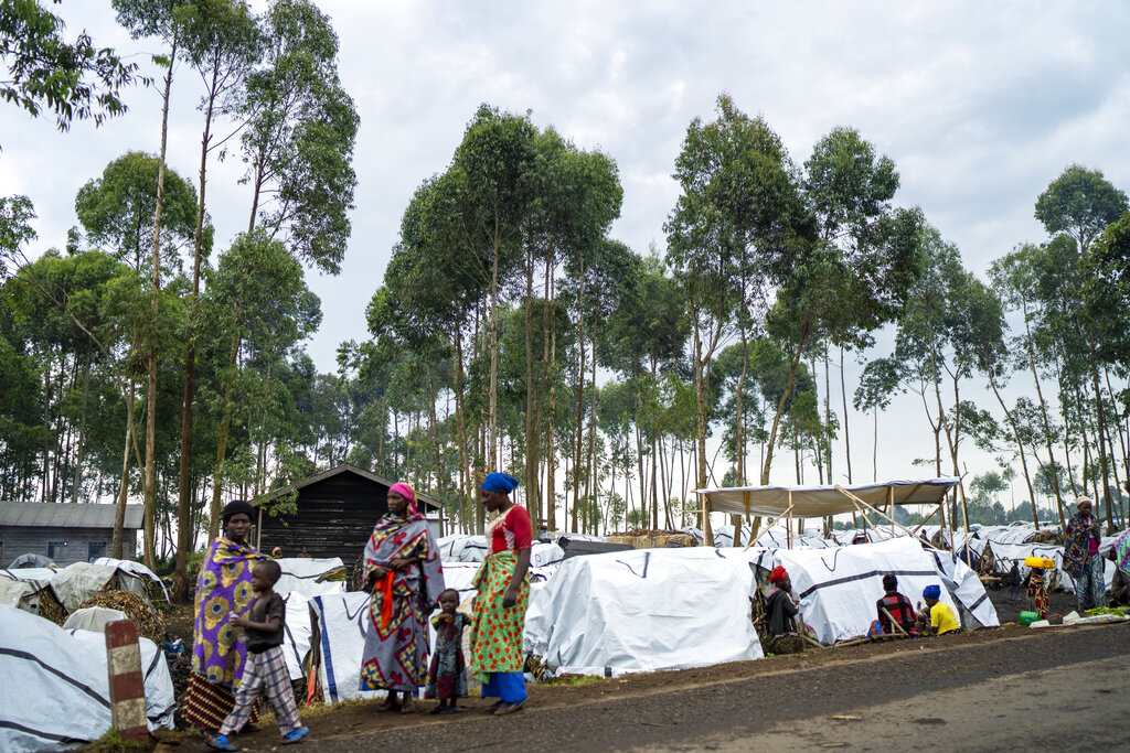 People displaced by the fighting between M23 rebels and FARDC government forces gather in the north of Goma, Democratic Republic of Congo, Friday Nov. 25, 2022.
