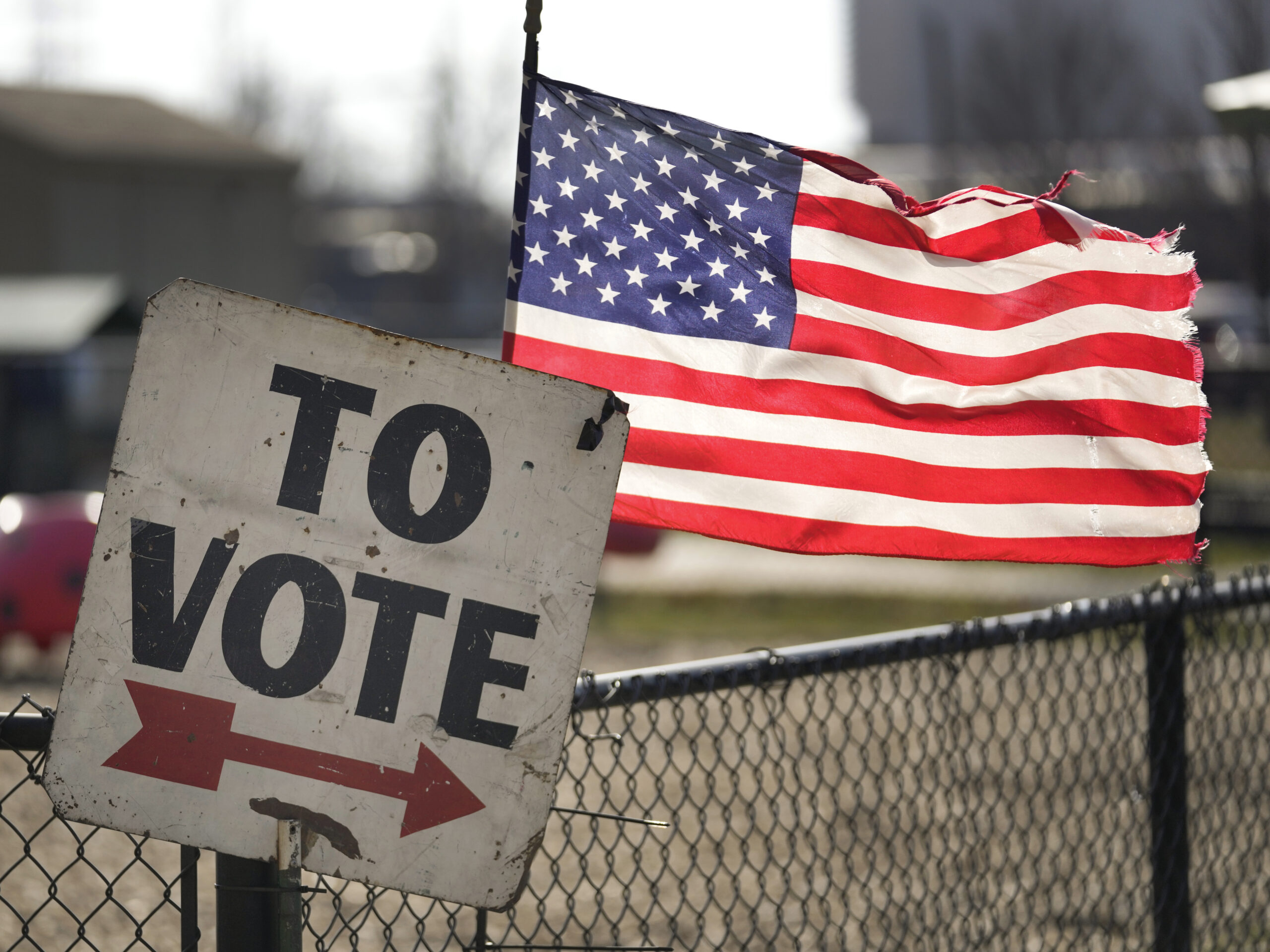 In one of the contests ahead of Super Tuesday on March 5, a vote sign and American flag are shown outside a Michigan primary election location in Dearborn, Mich., on Feb. 27.