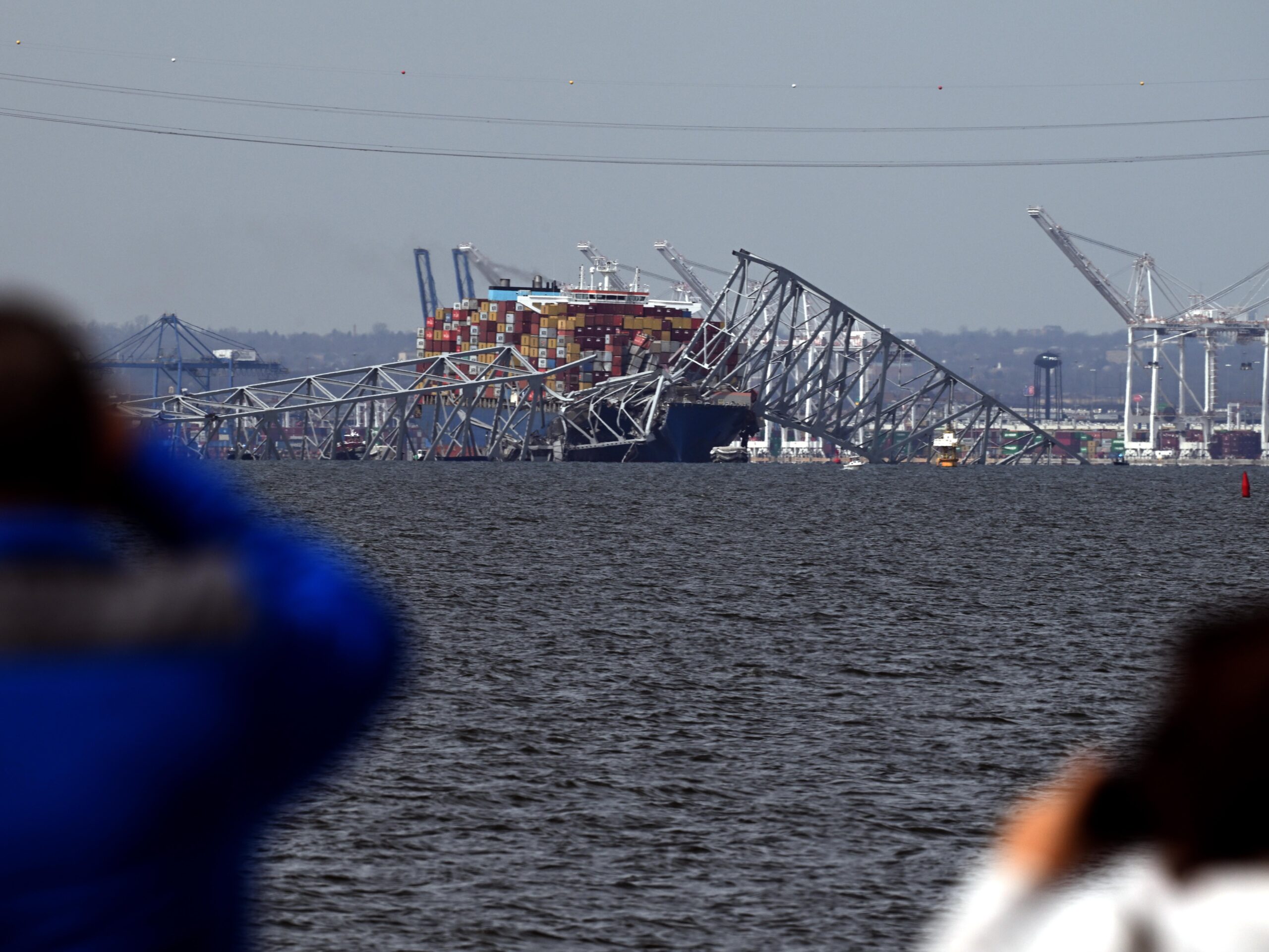 Francis Scott Key Bridge collapsed after being hit by the Dali container vessel, as seen from Riviera Beach, Md., on Tuesday.