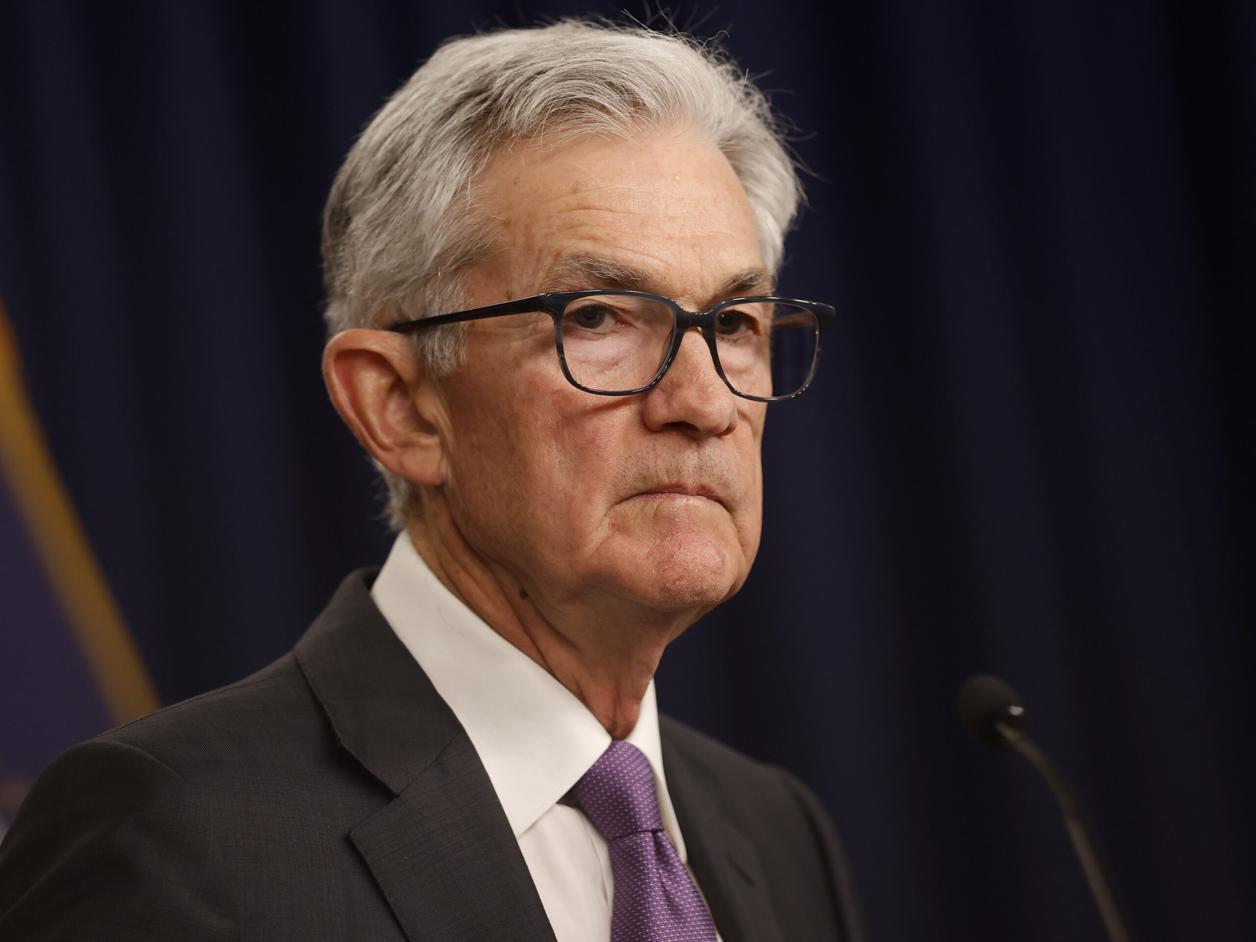 Federal Reserve holds interest rates steady, projects three rate cuts later this year