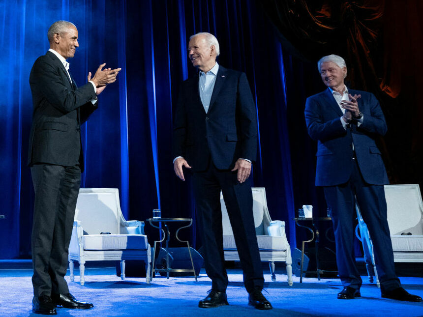 Former Presidents Barack Obama and Bill Clinton clap for President Biden during a campaign fundraising event at Radio City Music Hall in New York City on Thursday.