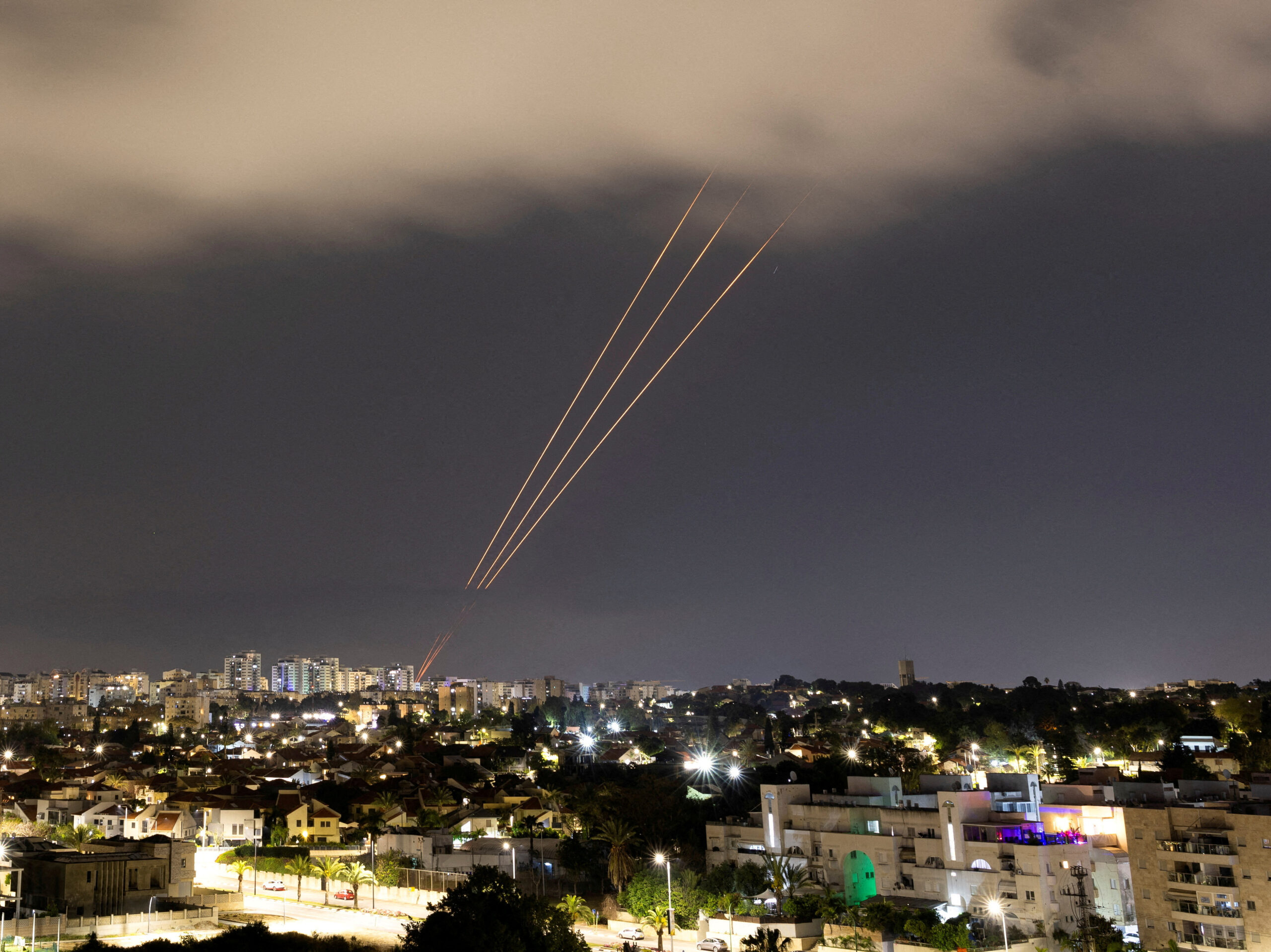 An anti-missile system operates after Iran launched drones and missiles toward Israel, as seen from Ashkelon, Israel, April 14.