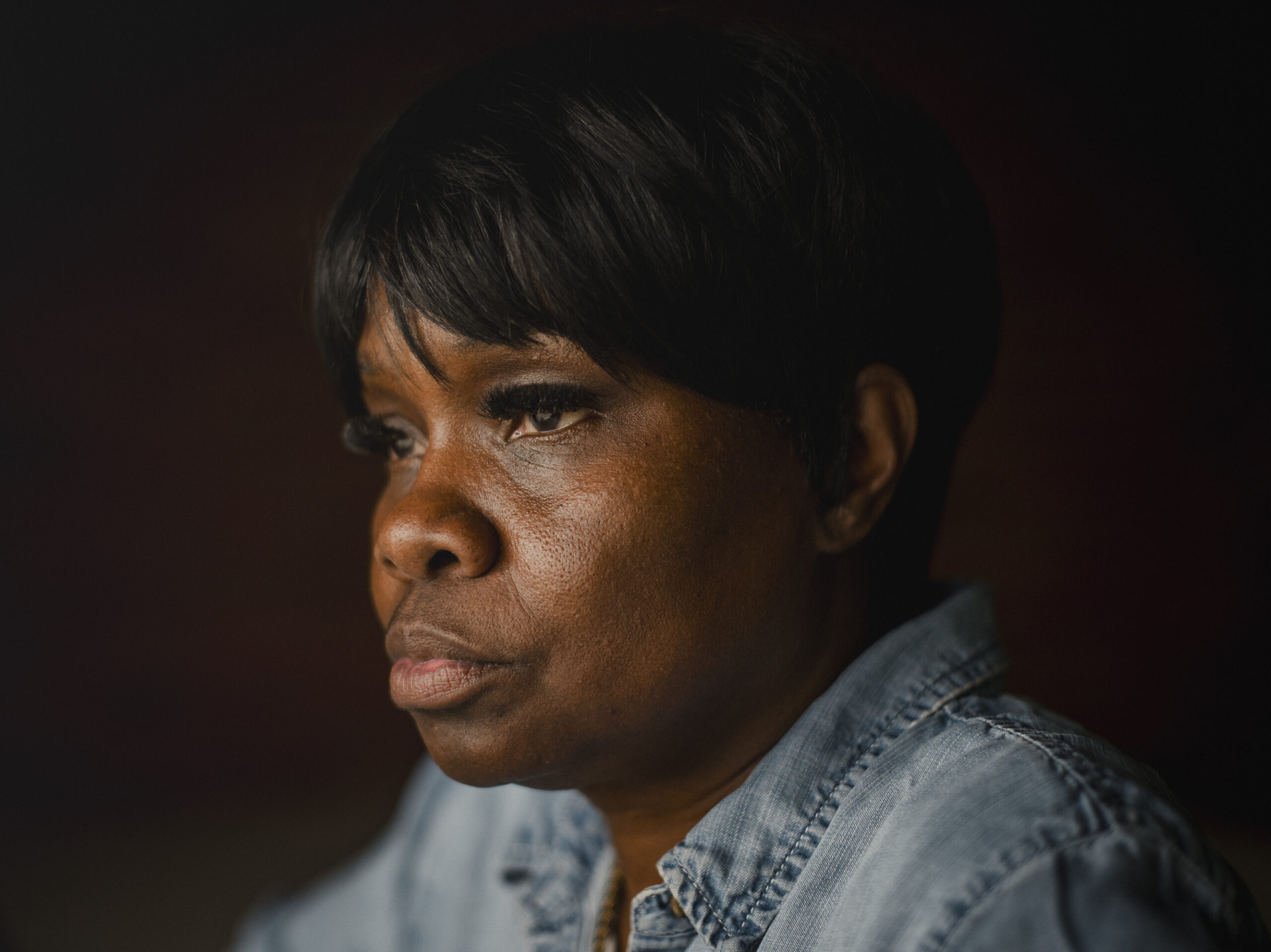 Tanya Warden, 55, sits for a portrait at her workplace in Philadelphia on Tuesday, March 26 2024. Warden's son, Tyron Alexander, was shot multiple times and died in October 2020.