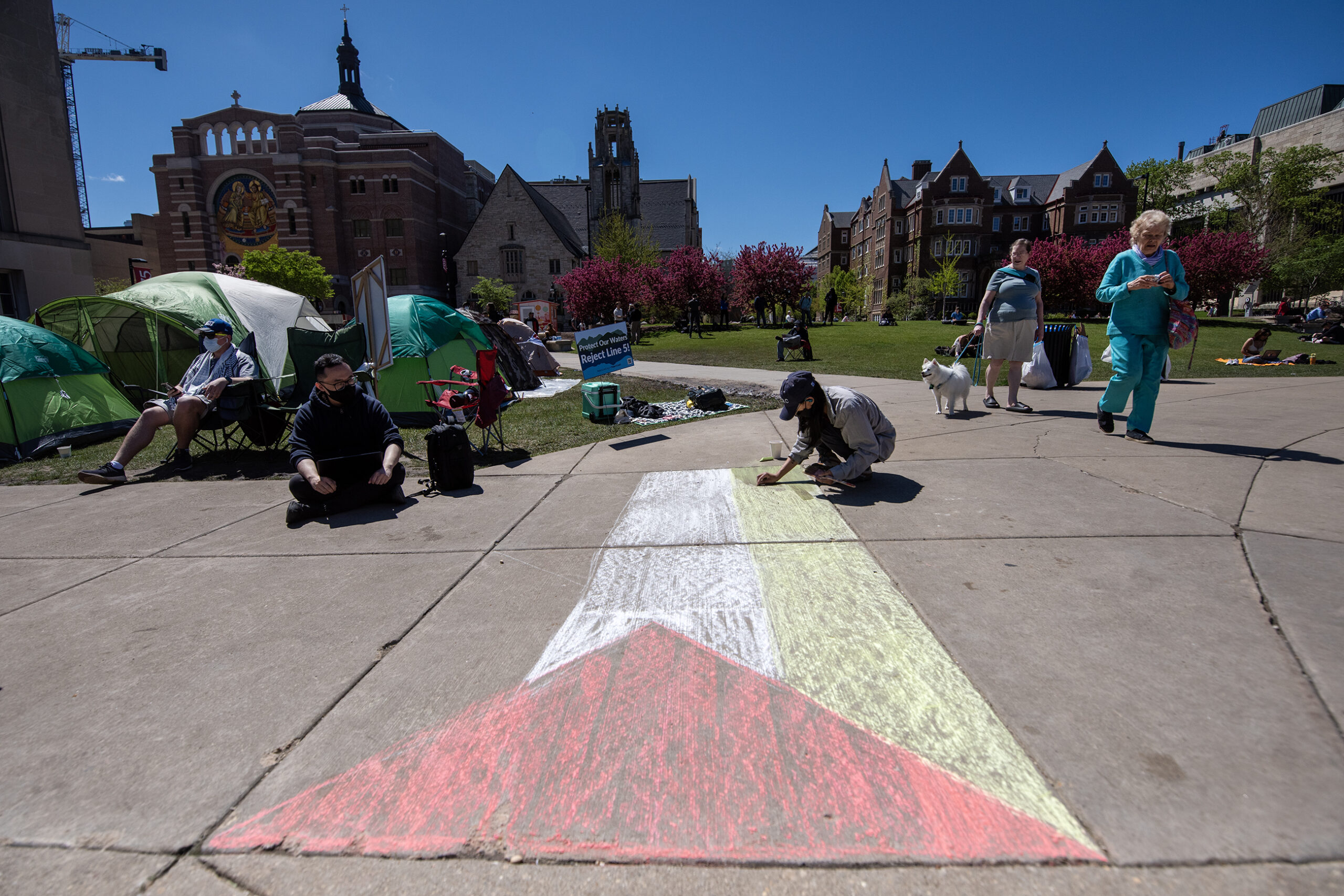 A large Palestinian flag is drawn on the ground.