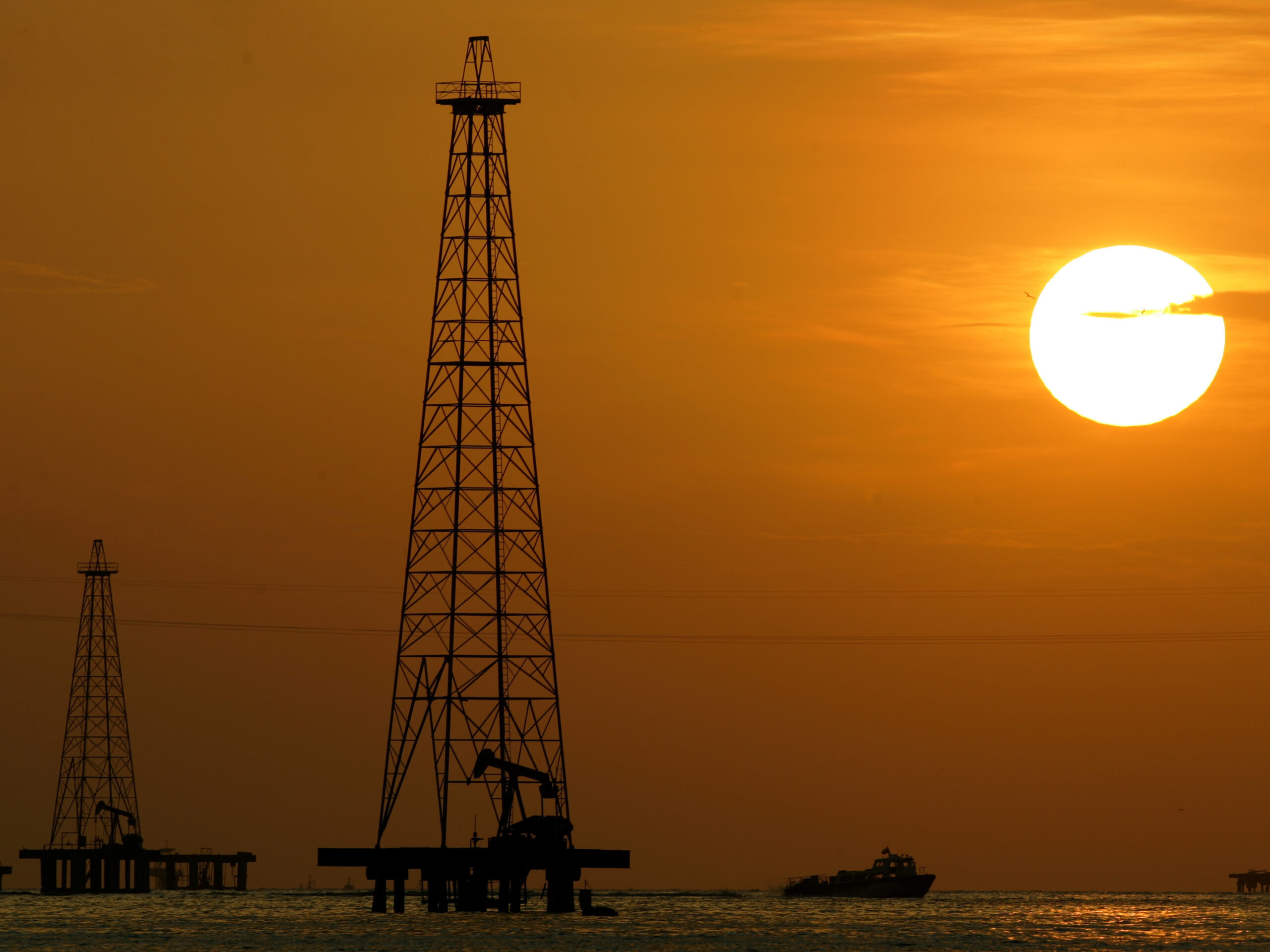 Oil drills in Maracaibo Lake in Venezuela's oil rich Zulia state. The U.S. is renewing sanctions on Venezuela's oil industry.