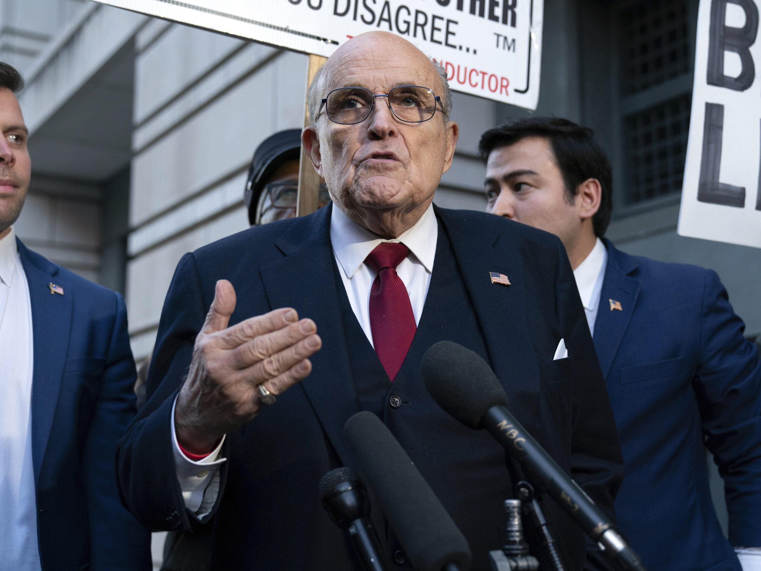 Rudy Giuliani speaks during a news conference after his defamation trial