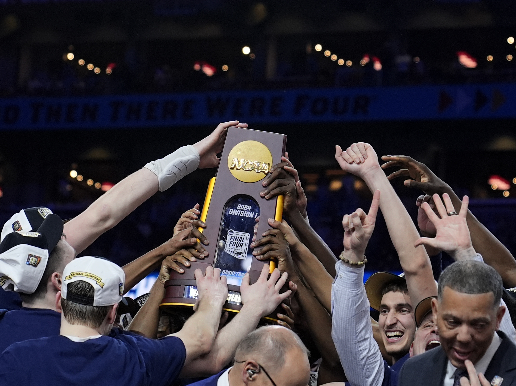 UConn players celebrate after the NCAA college Final Four championship basketball game against Purdue, Monday, April 8, 2024, in Glendale, Ariz.