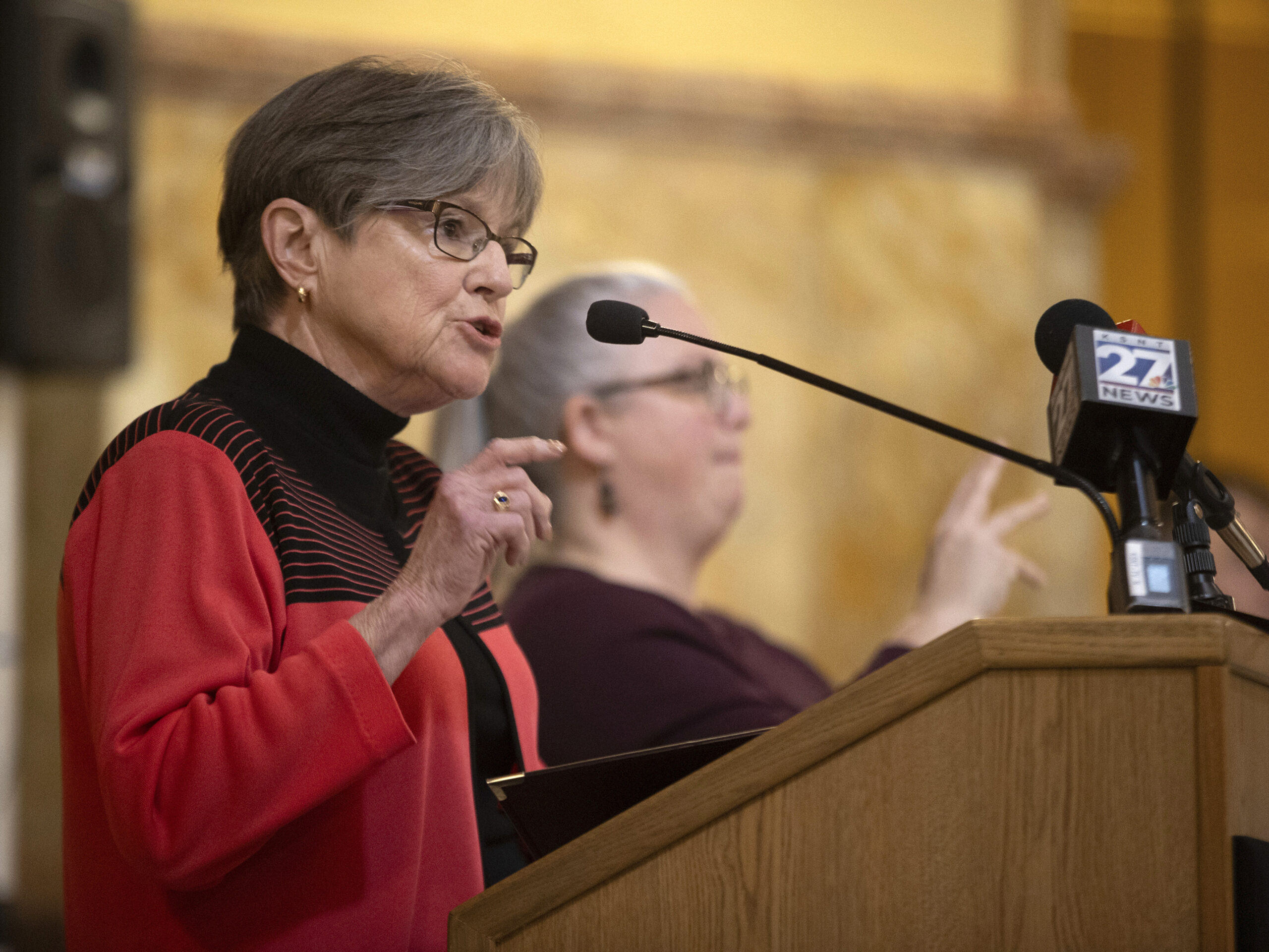 Kansas Gov. Laura Kelly speaks about the necessity to expand Medicaid in the state during a rally on March 6 in Topeka. Kelly on Friday vetoed a proposed ban on gender-affirming care for minors.