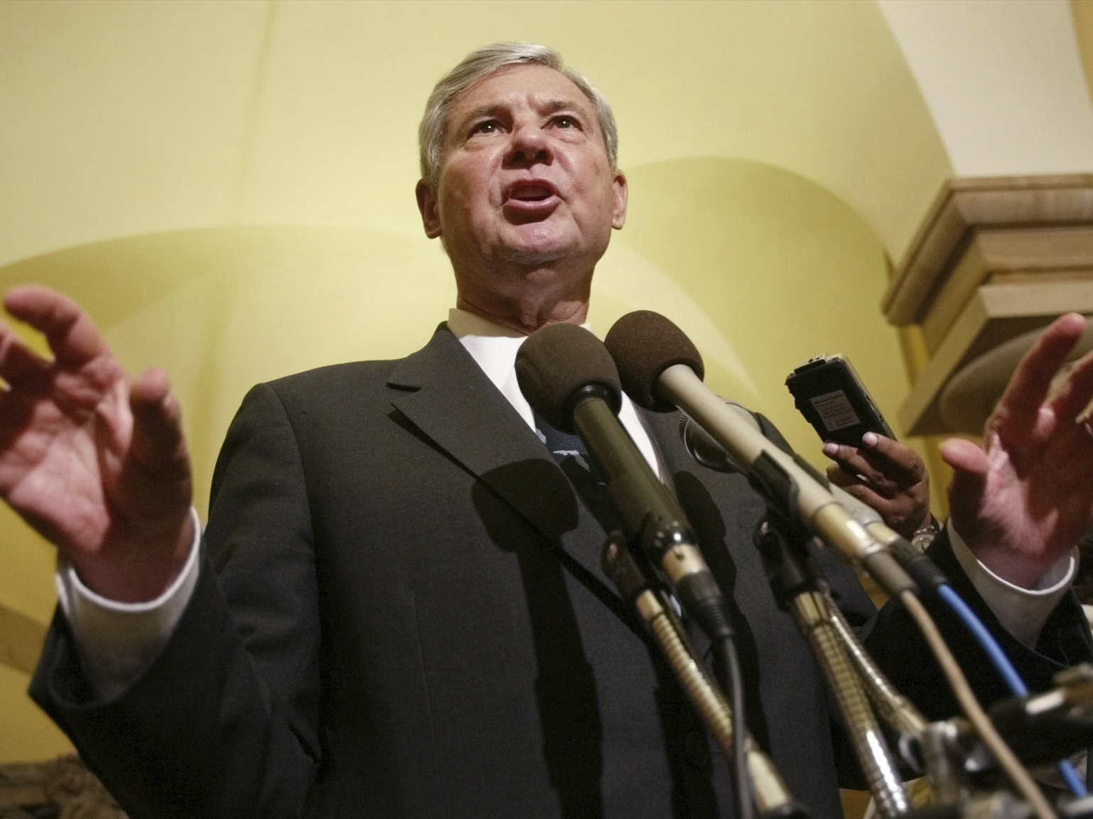 Former Senate Intelligence Committee Chairman Sen. Bob Graham, D-Fla., gestures as he answers questions on Capitol Hill, June 18, 2002, in Washington.