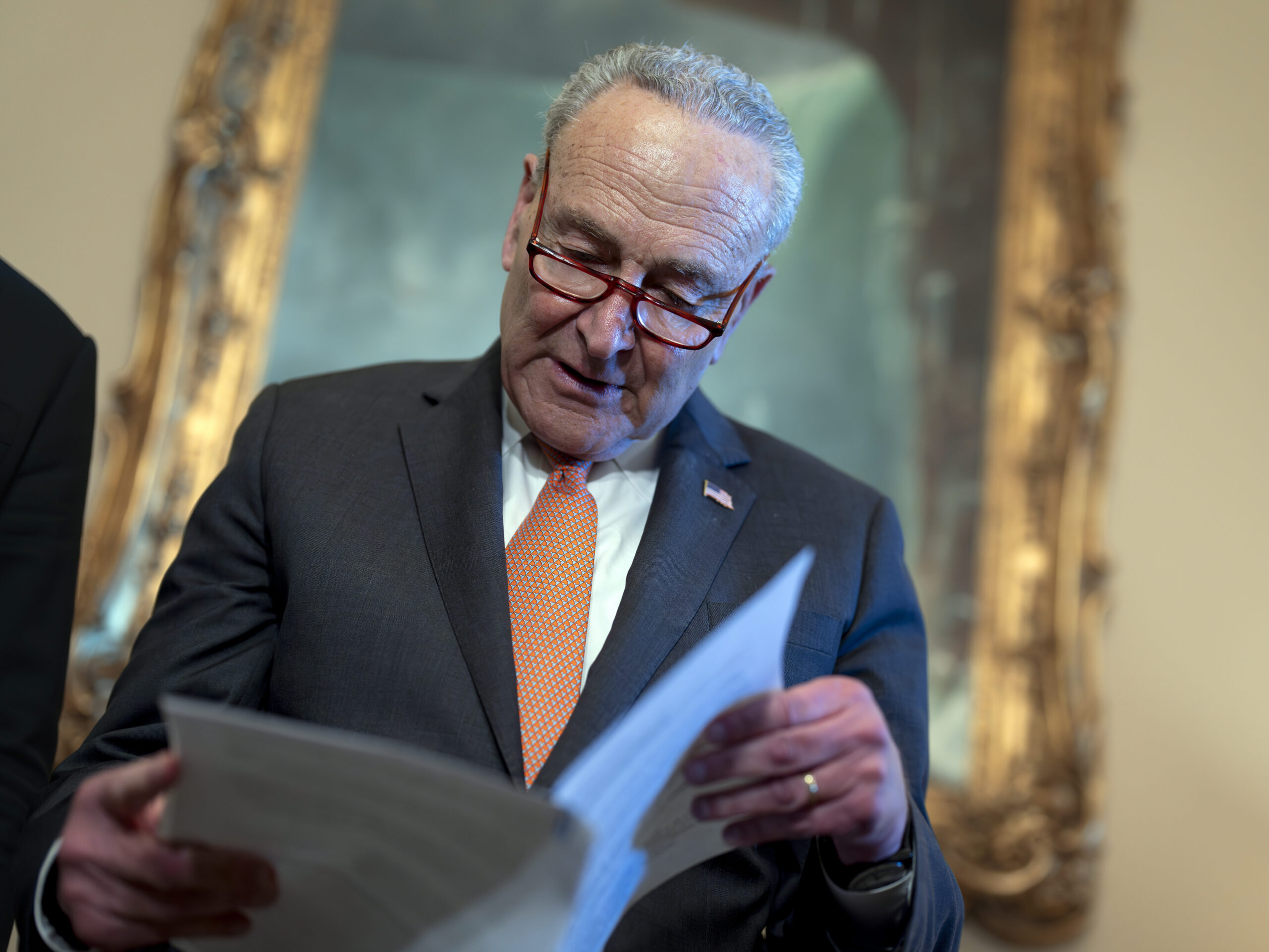 Senate Majority Leader Chuck Schumer, D-N.Y., looks over his notes during a meeting with Ukraine's Prime Minister Denys Shmyhal as Congress moves to advance an emergency foreign aid package for Israel, Ukraine and Taiwan, at the Capitol in Washington, Thursday, April 18, 2024.