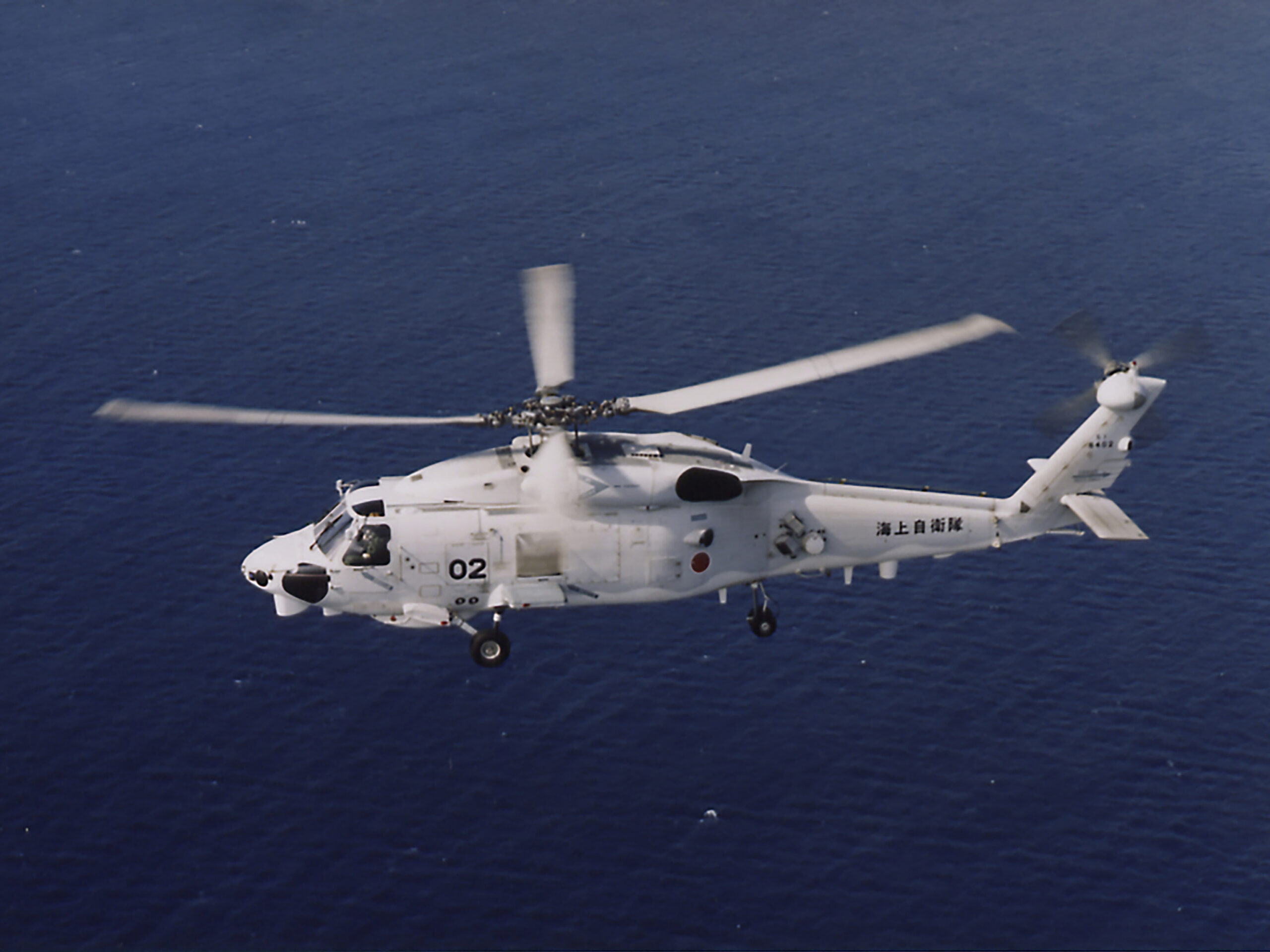This undated photo released by and taken from the official website of the Japan Maritime Self-Defense Force, shows a SH-60K chopper. Two Japanese navy helicopters of the same type crashed in the Pacific Ocean south of Tokyo during a nighttime training flight after possibly colliding with each other, the country's defense minister said Sunday, April 21, 2024.