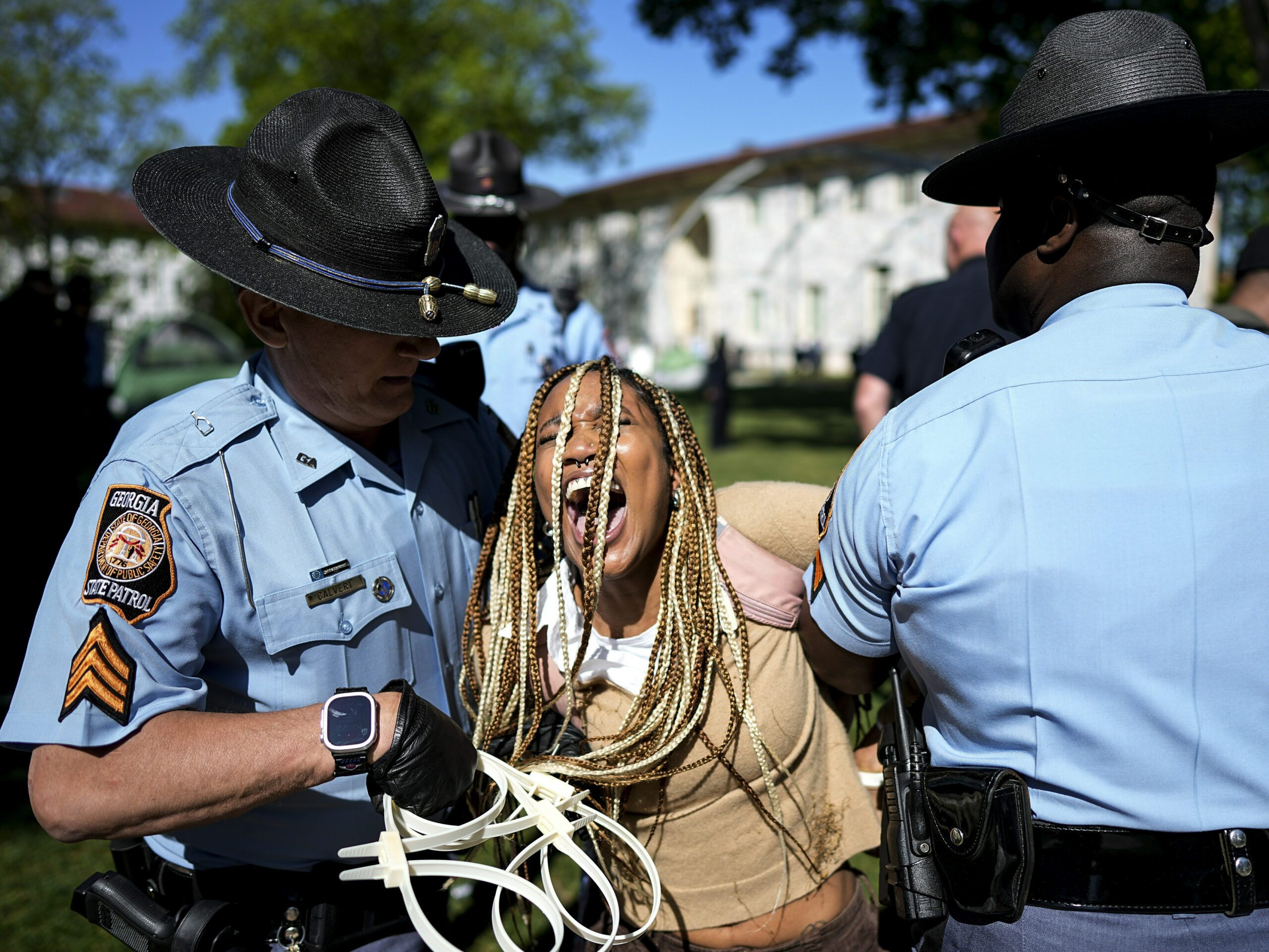 Georgia State Patrol officers detain a demonstrator on the campus of Emory University during a pro-Palestinian demonstration on Thursday, April 25, 2024, in Atlanta.
