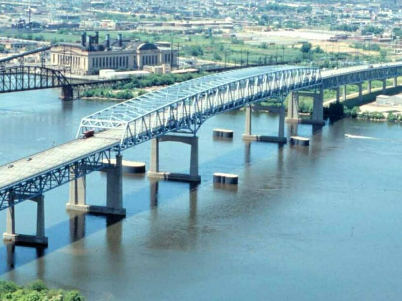 The Betsy Ross Bridge in Philadelphia is a continuous truss bridge like the Francis Scott Key Bridge. It also has four dolphins around it.