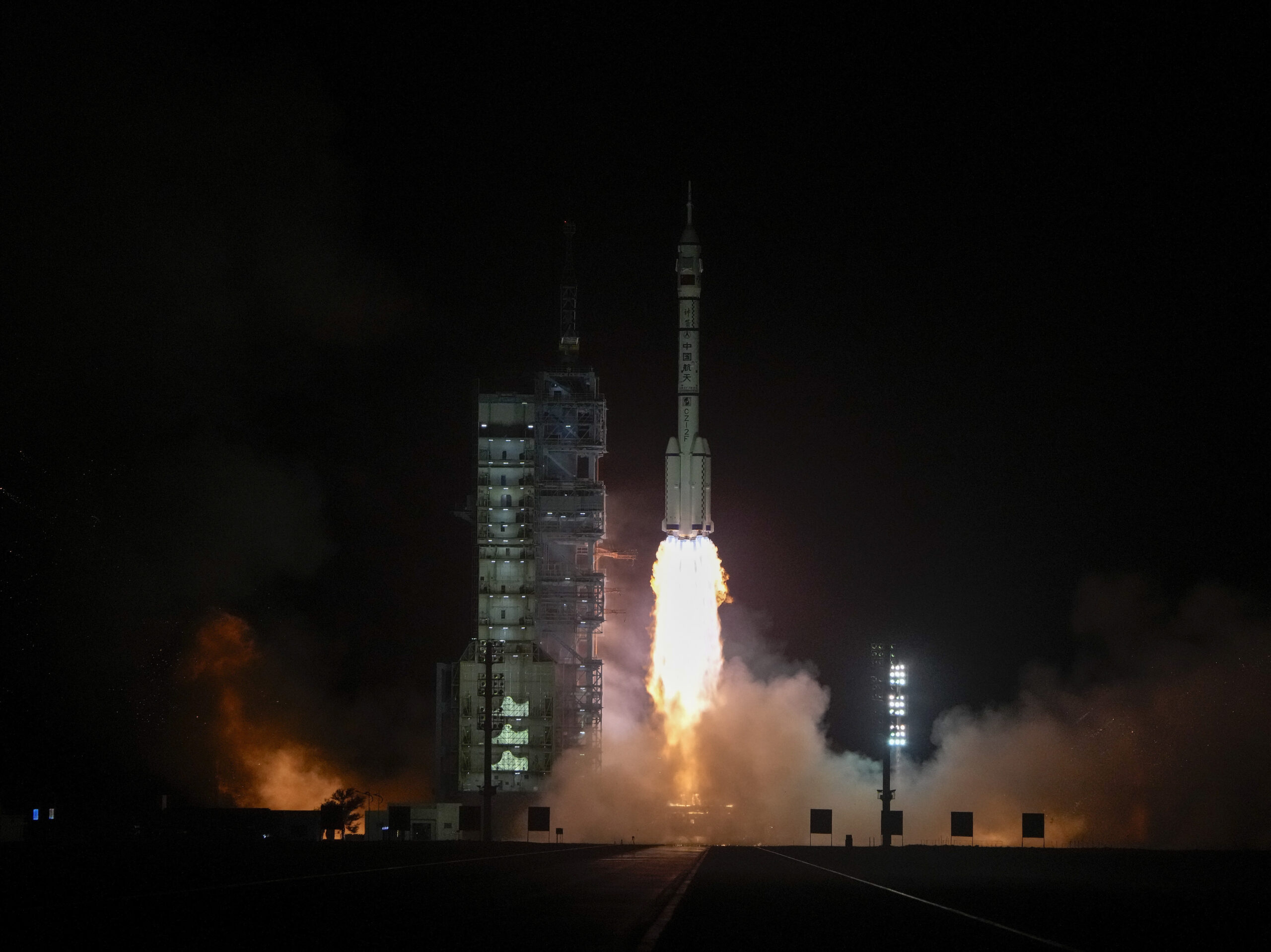 A Long March rocket carrying a crew of Chinese astronauts in a Shenzhou-18 spaceship lifts off at the Jiuquan Satellite Launch Center in northwestern China on Thursday.