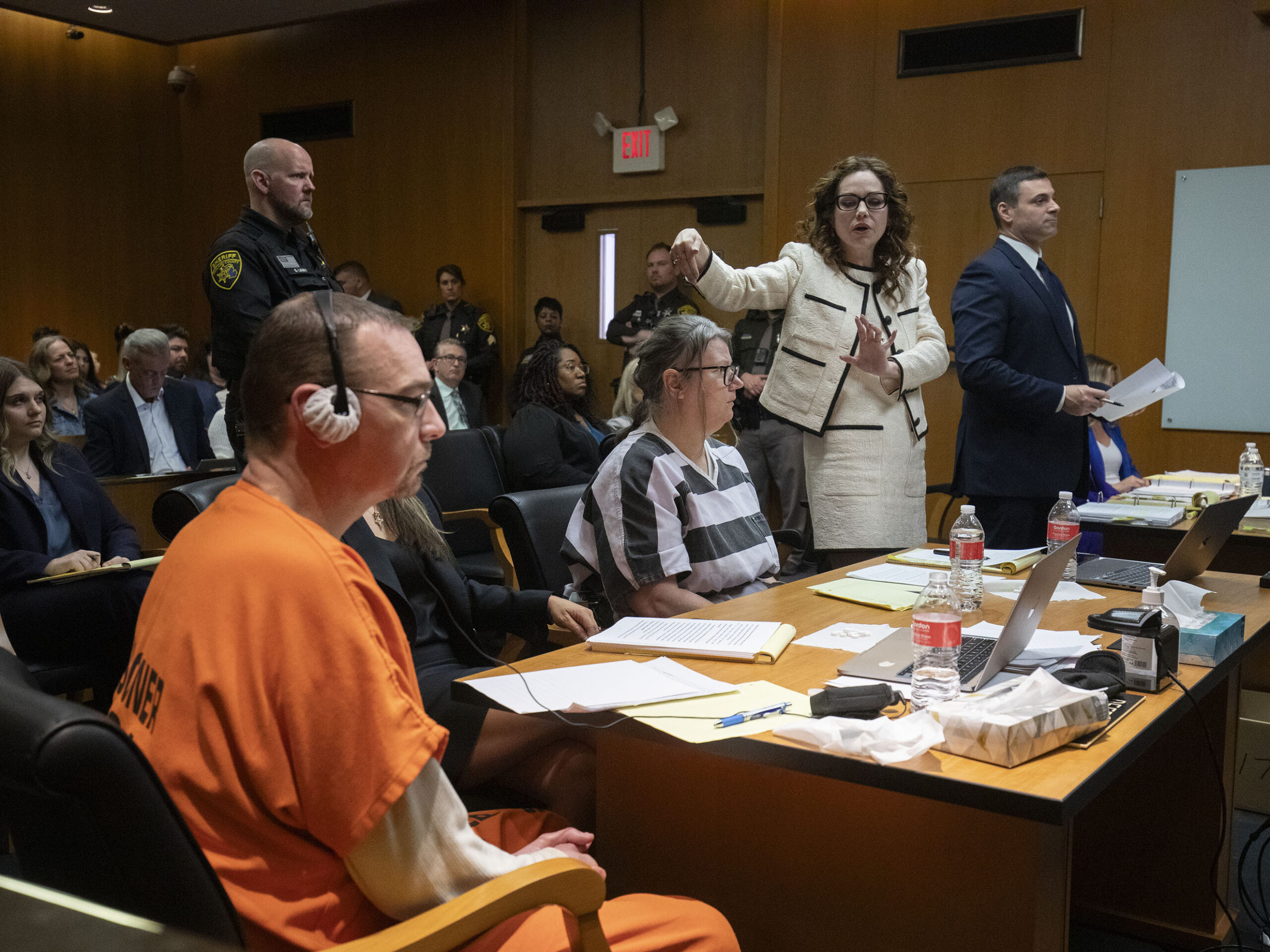 (From left) James Crumbley, his attorney Mariell Lehman, Jennifer Crumbley and her attorney Shannon Smith sit in court in Pontiac, Mich., for Tuesday's sentencing on four counts of involuntary manslaughter for the deaths of four Oxford High School students who were shot and killed by the Crumbleys' son.