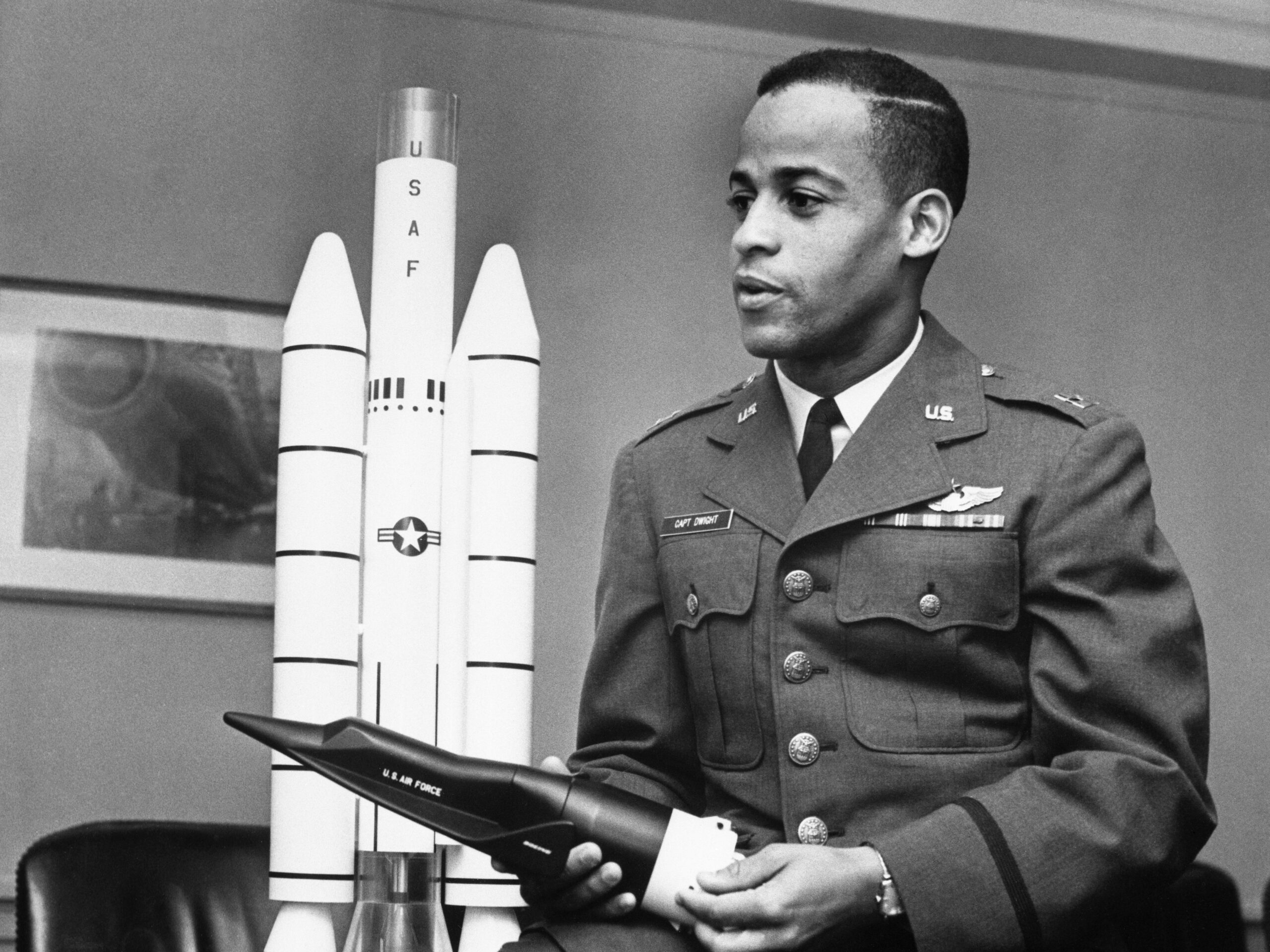 Air Force Capt. Edward J. Dwight Jr., the first African American selected as a potential astronaut, looks over a model of the Titan III-X-20 Dyna-Soar combination during a visit to Air Force headquarters in the capital in November 1963.
