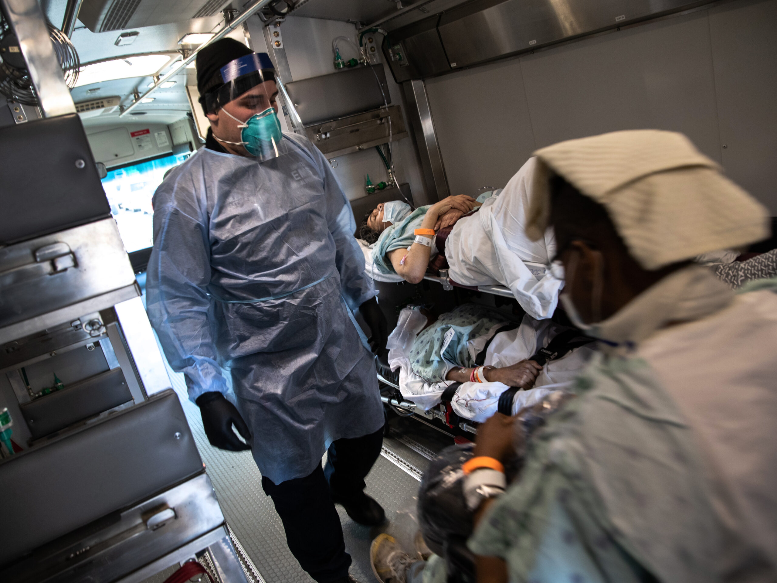 An EMT wearing personal protective equipment prepares to unload COVID-19 transfer patients in the early days of the pandemic. The Biden Administration has just announced a new program aimed at preventing the next pandemic.