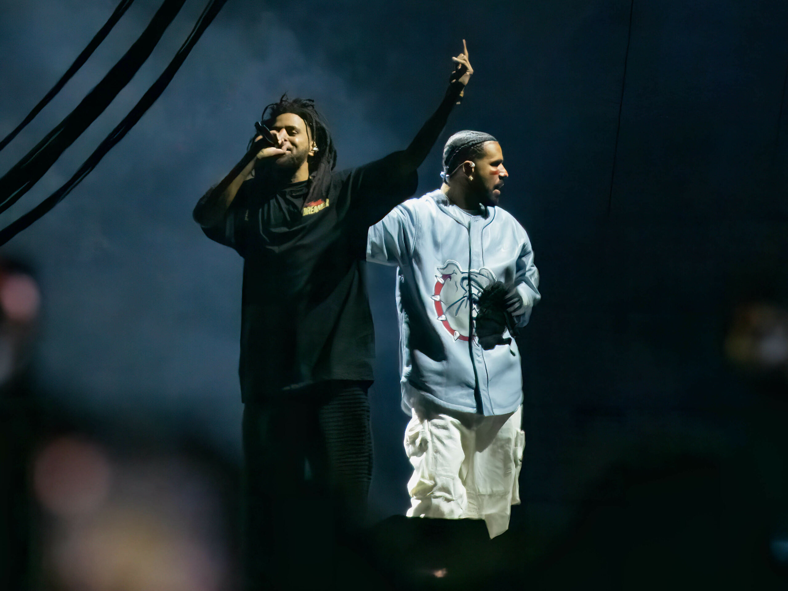 J. Cole and Drake perform during the 2023 edition of Cole's Dreamville Festival in Raleigh, N.C., last April. Their collaborative track "First Person Shooter" recently touched off a conflict with fellow MC Kendrick Lamar.