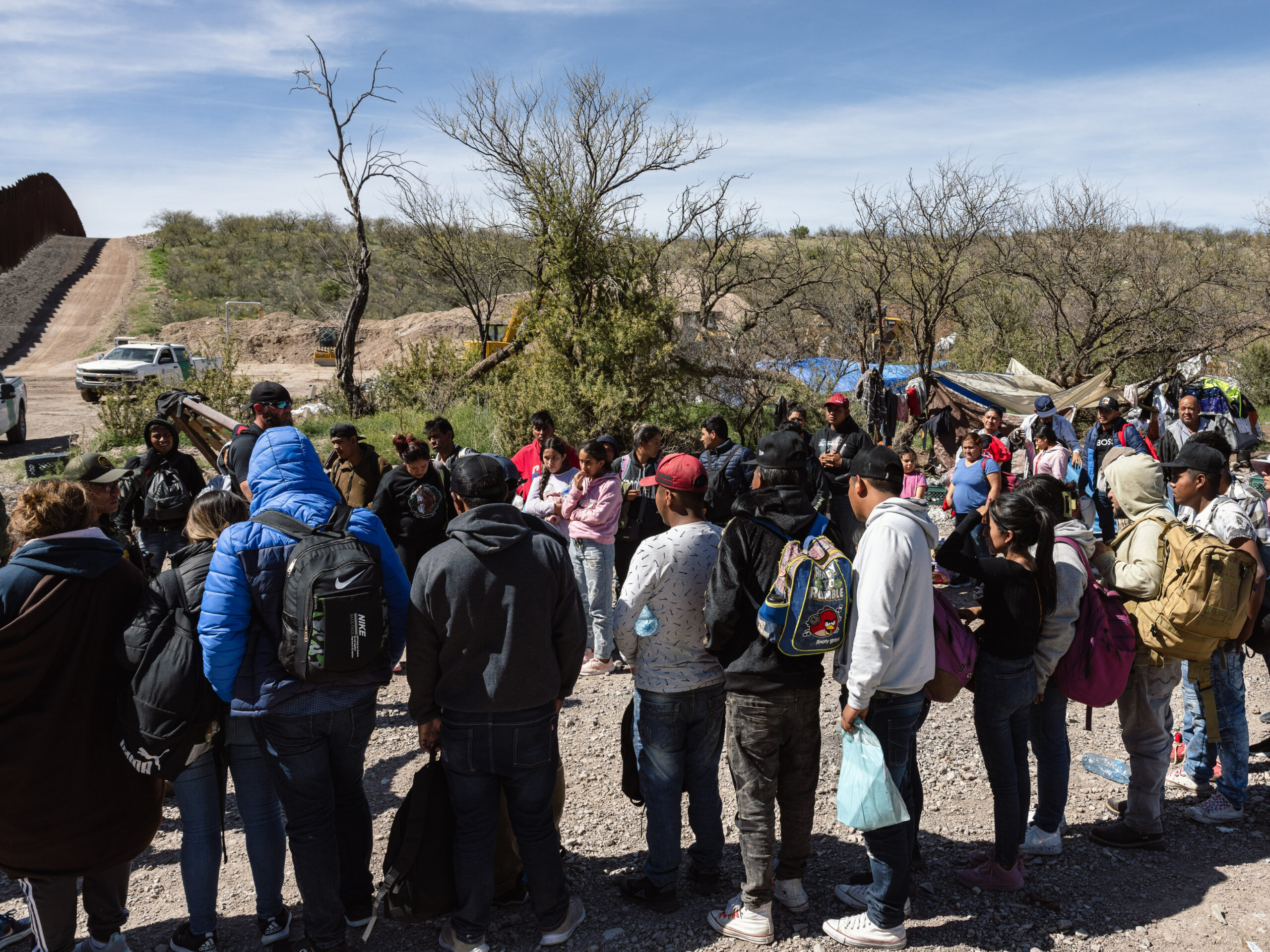 Border Patrol picks up a group of people seeking asylum from an aid camp near Sasabe, Arizona, on Wednesday, March 13, 2024.