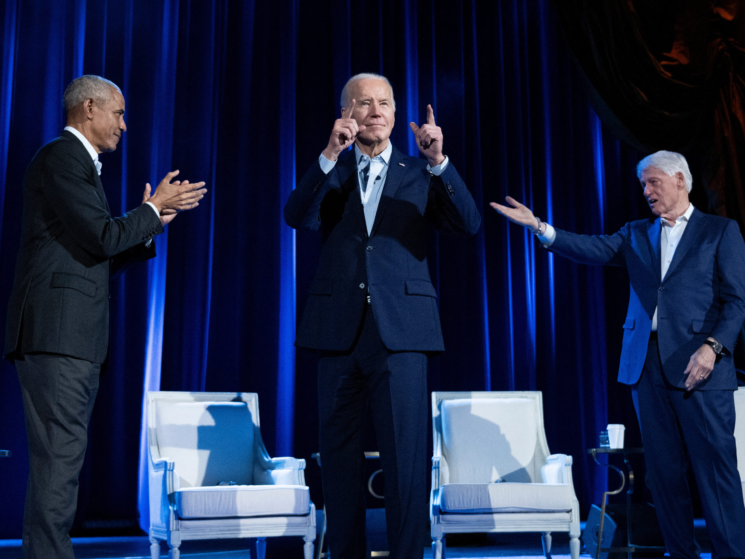 Former President Barack Obama (left) and former President Bill Clinton (right) cheer for President Biden during a campaign fundraising event at Radio City Music Hall in New York City on March 28.
