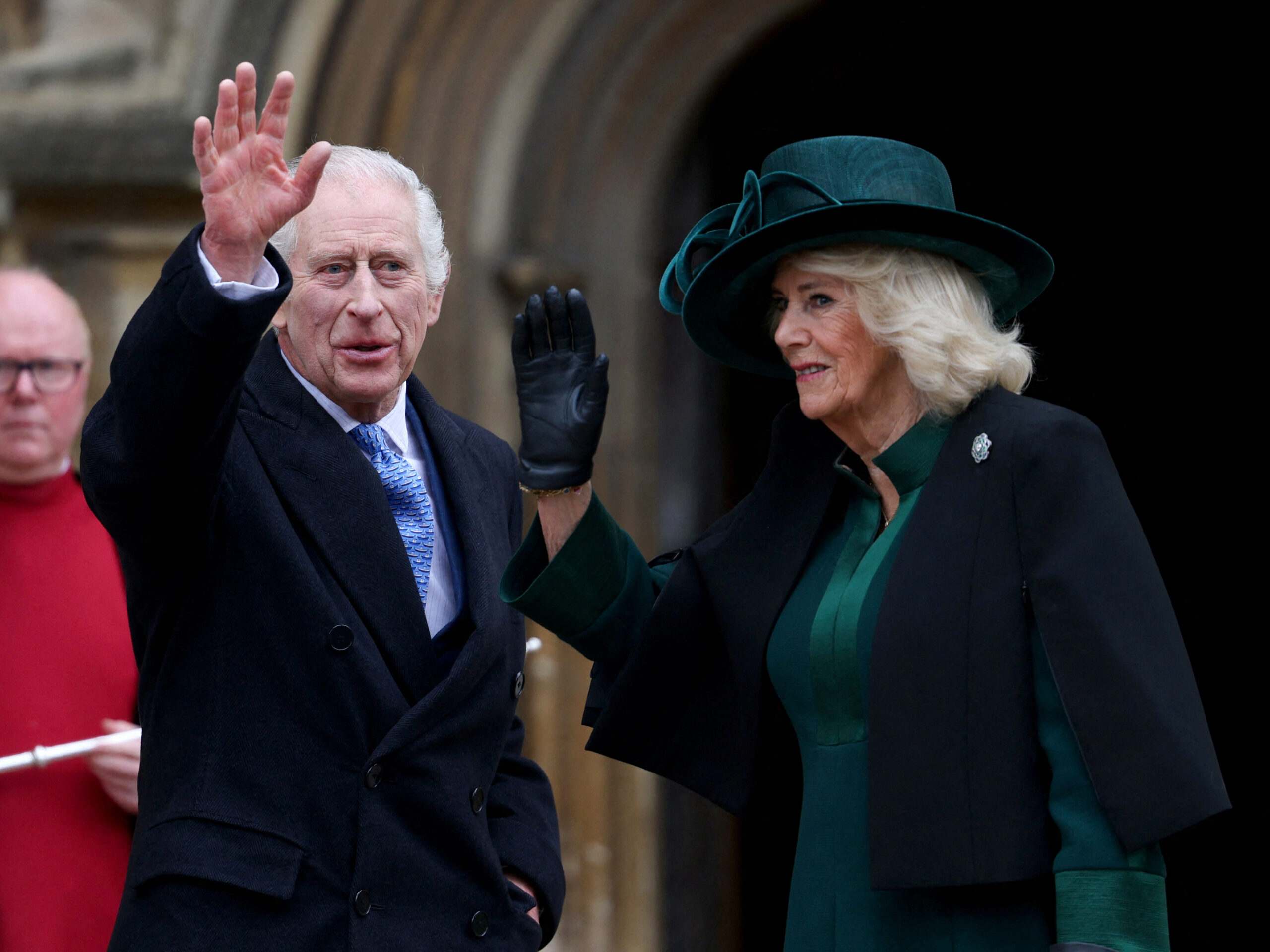 Britain's King Charles III (center), next to Queen Camilla, waves as they arrive at St. George's Chapel, Windsor Castle, on March 31.