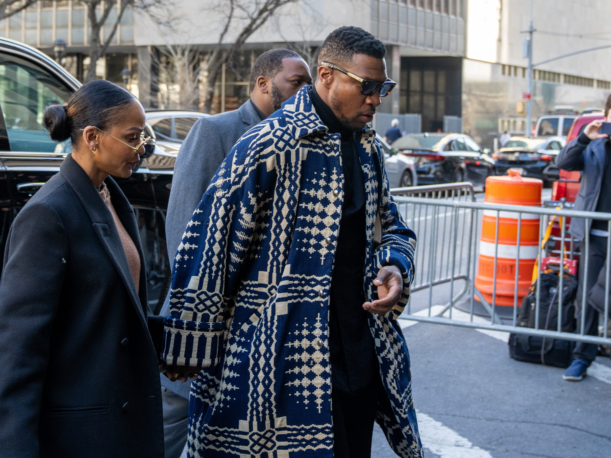 Actor Jonathan Majors arriving in court for his sentencing Monday morning in Manhattan, accompanied by his current partner, Meagan Good.