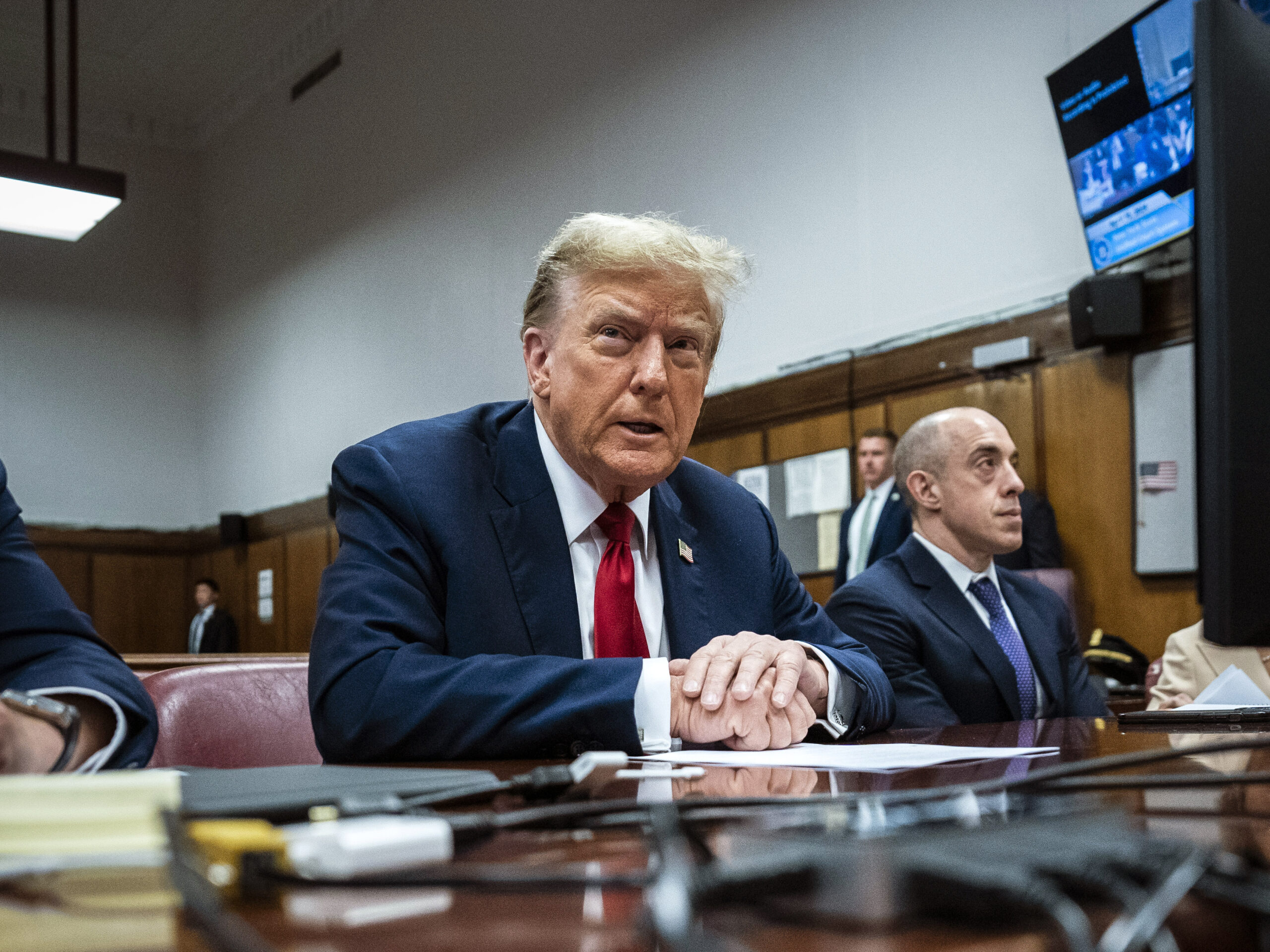 Former President Donald Trump appears with his legal team ahead of the start of jury selection Monday at Manhattan criminal court. Trump faces 34 felony counts of falsifying business records in the first of his criminal cases to go to trial.