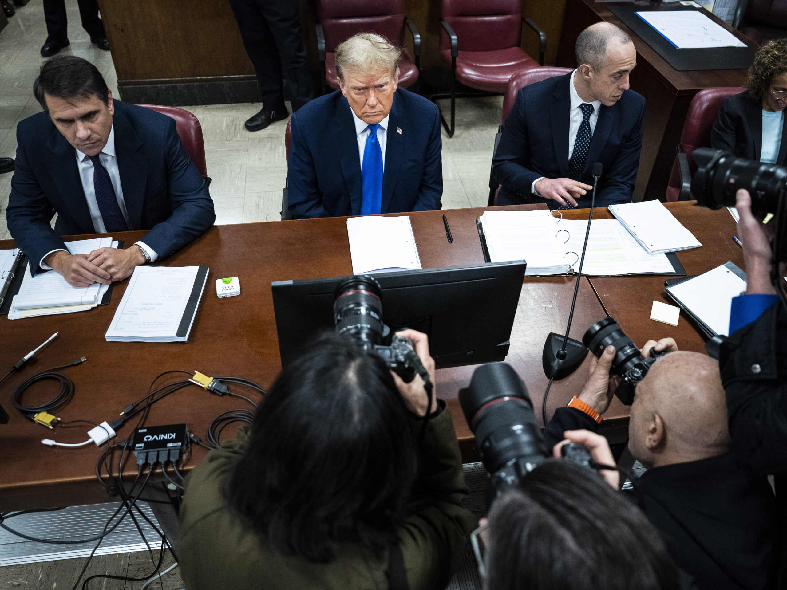 Former U.S. President Donald Trump (C), flanked by attorneys Todd Blanche (L) and Emil Bove (R), arrives for his criminal trial as jury selection continues at Manhattan Criminal Court on April 18, 2024 in New York City.