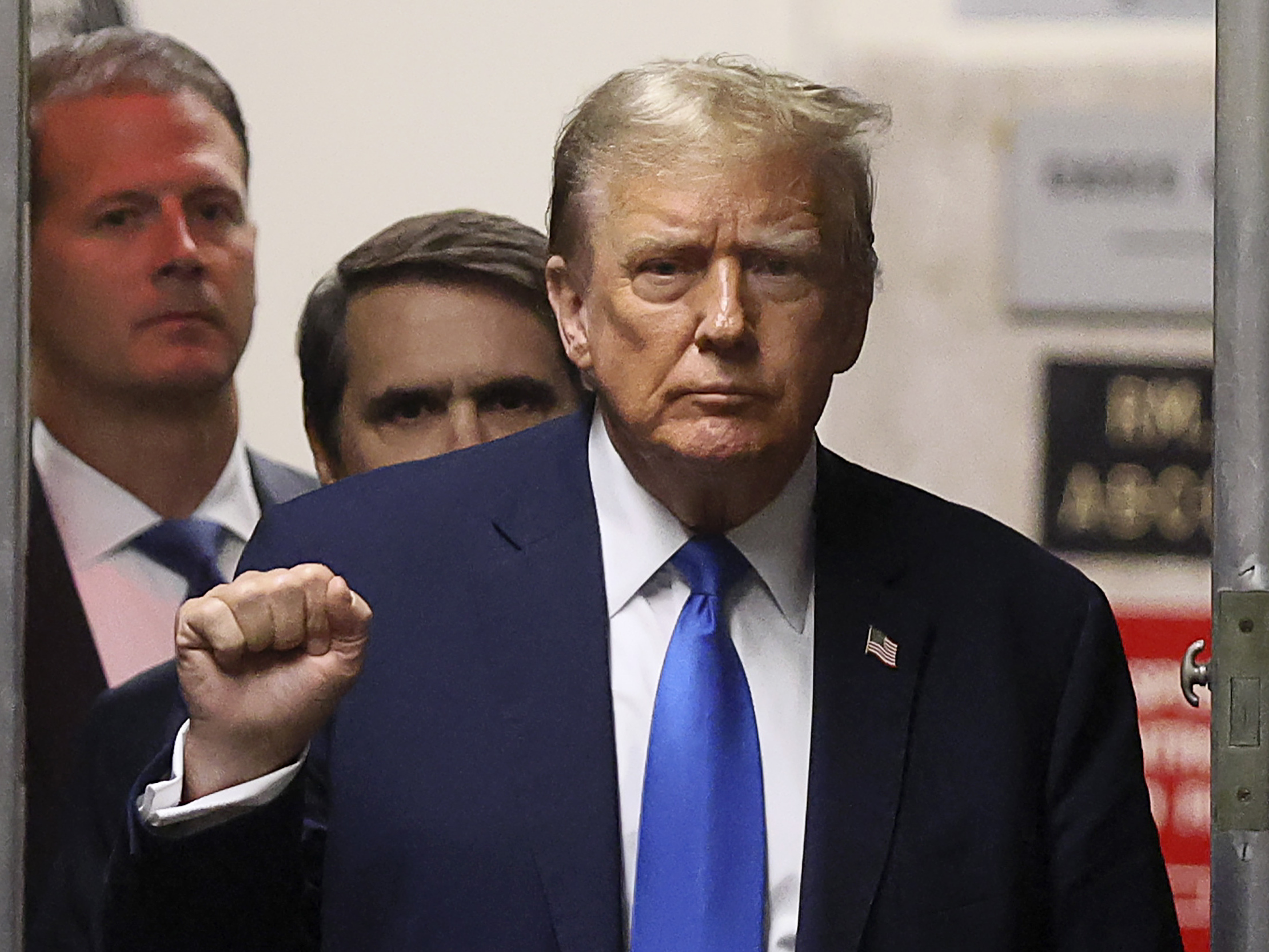 Former President Donald Trump gestures as he returns to the courtroom during a recess in his criminal trial at Manhattan Criminal Court on Thursday.