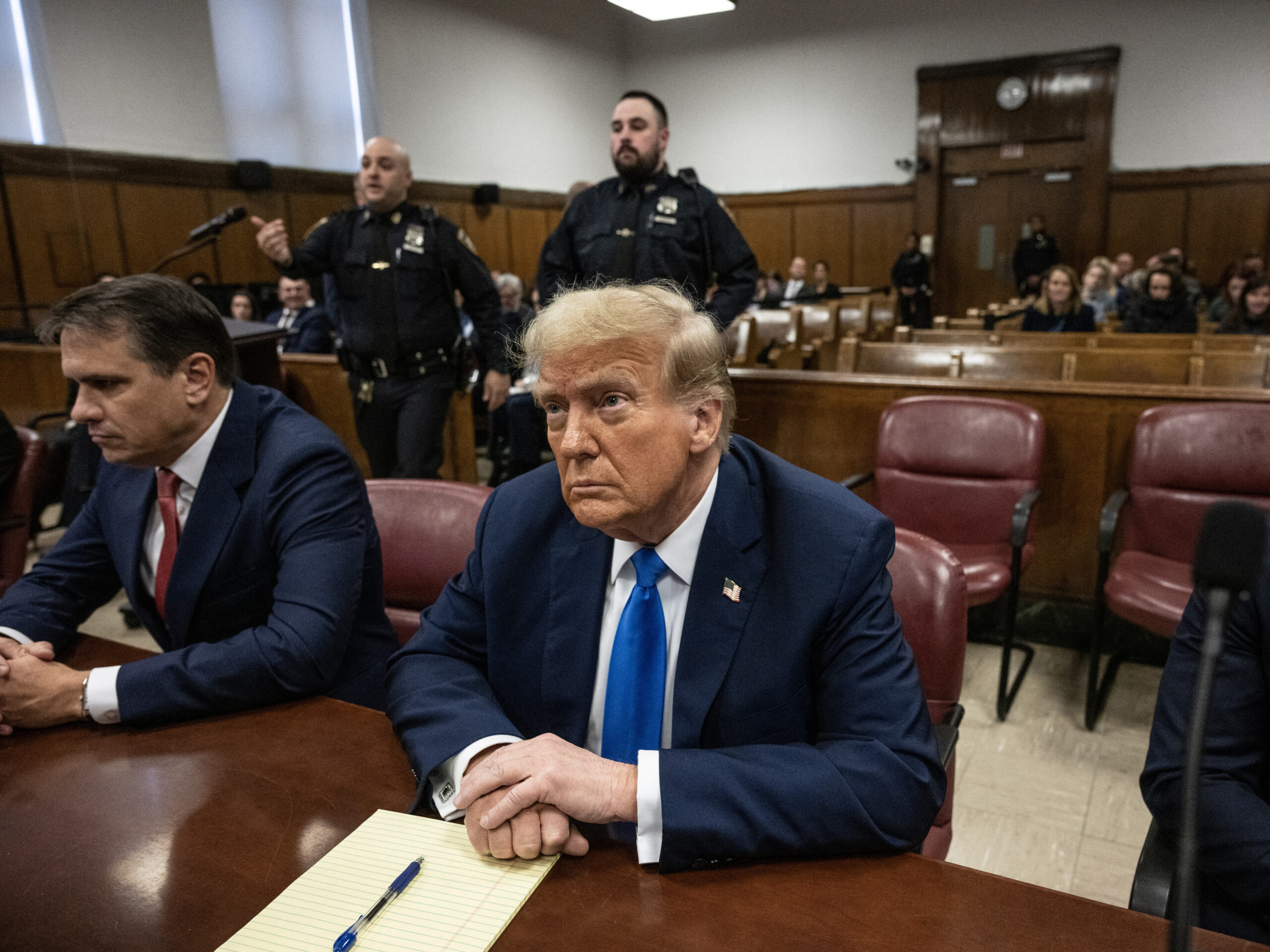 Former president and Republican presidential candidate Donald Trump looks on at Manhattan criminal court during his trial for allegedly covering up hush money payments linked to extramarital affairs in New York on Monday.