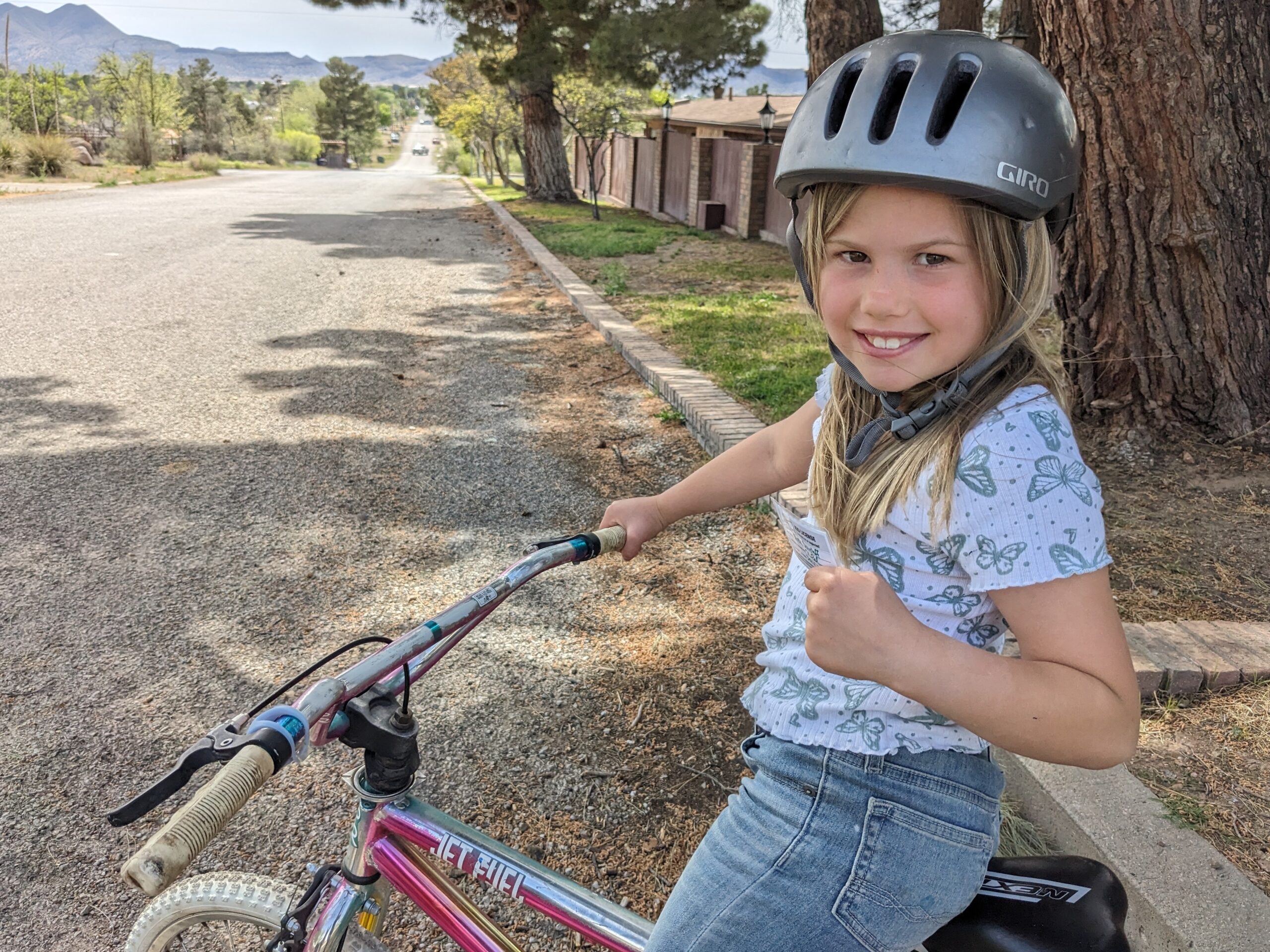 The author's 8-year-old daughter Rosy has a 'kids' license,' showing she has her parents' permission to ride her bike around her Texas hometown.