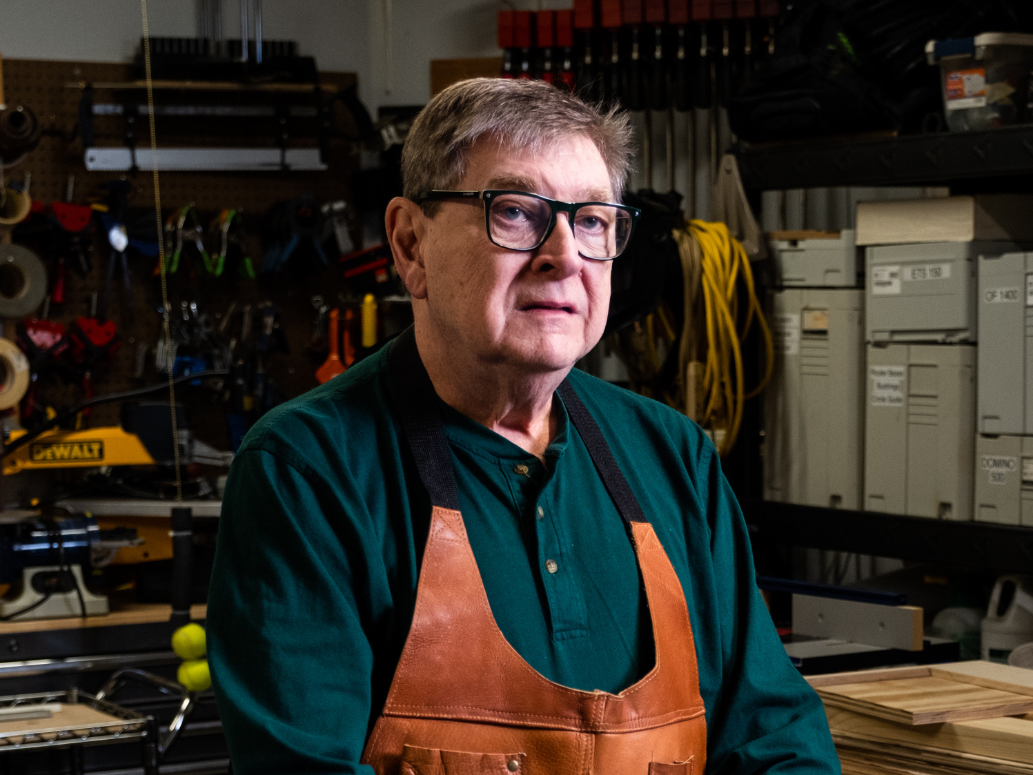 Tom Noffsinger stands in his garage workshop, where he uses a SawStop table saw for woodworking at his home in Raleigh, North Carolina. About 20 years ago, Noffsinger had a table saw accident and almost lost his thumb.