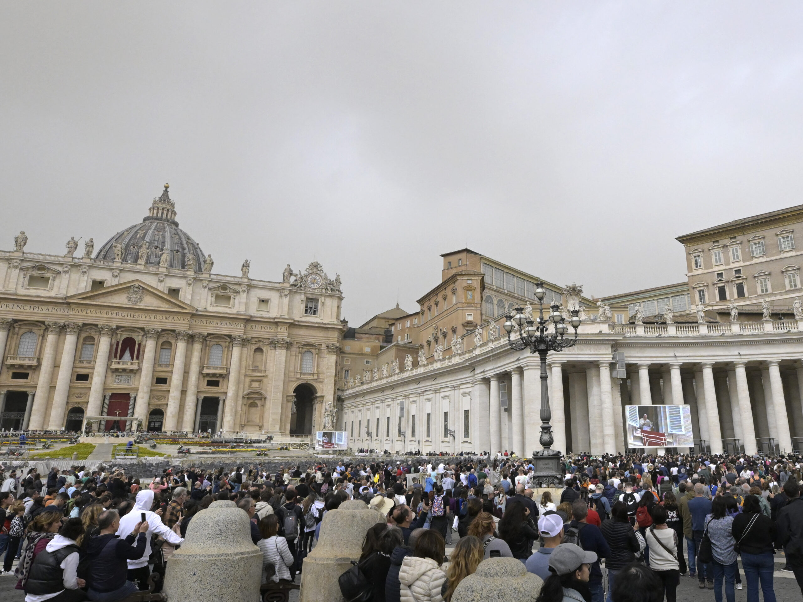 The crowd looks in direction of the window of the apostolic palace overlooking St. Peter's square during Pope Francis' prayer on April 1 in The Vatican.