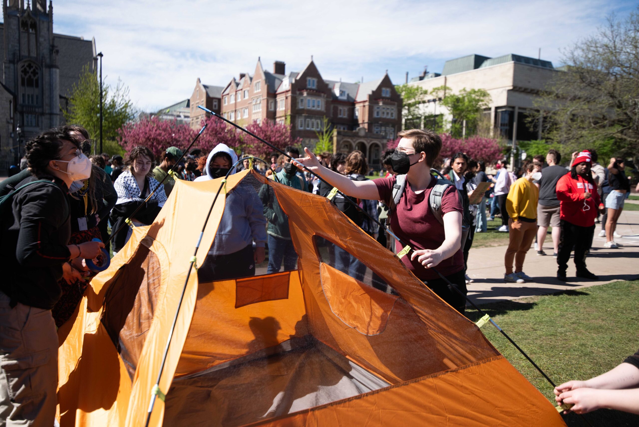 Protesters move tents to be closer to remaining supplies at UW-Madison.