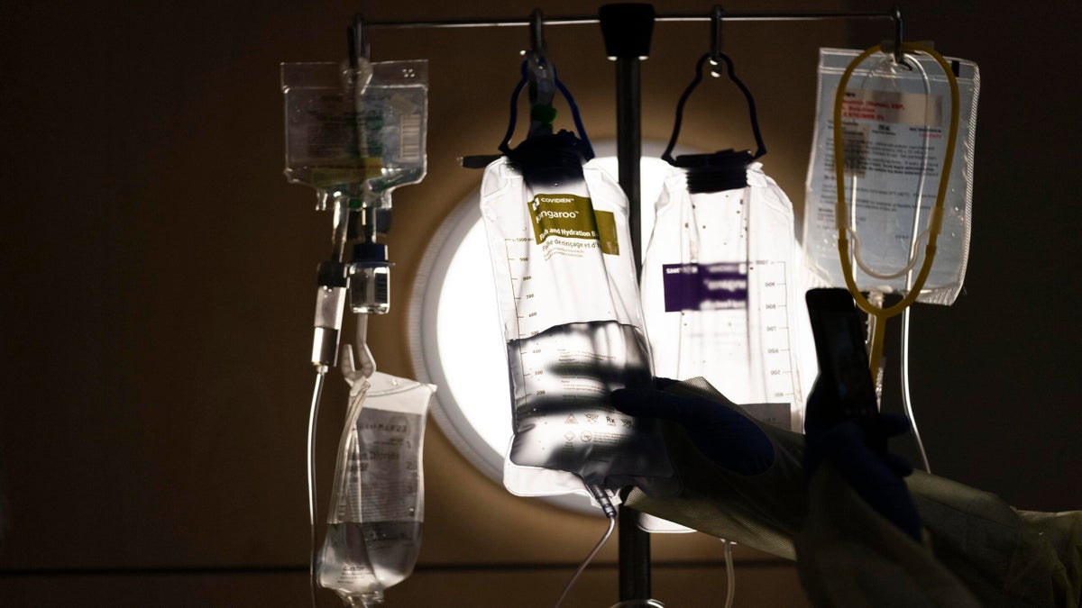 IV bags hang on a pole in a hospital