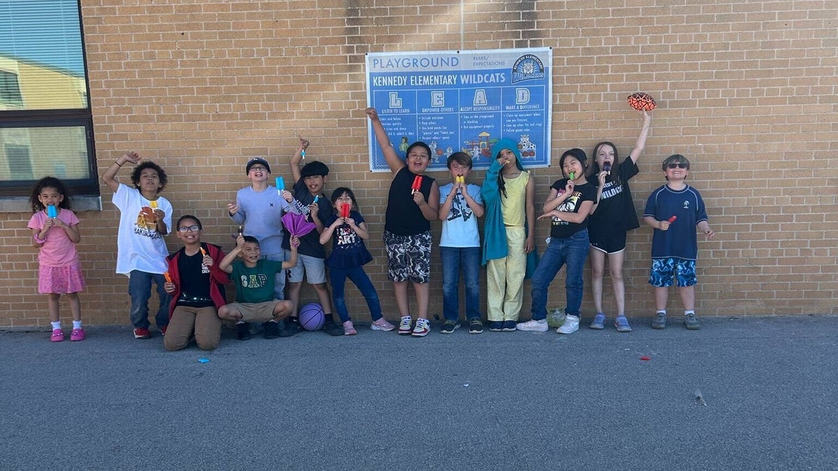 A group of kids posing for a photo.