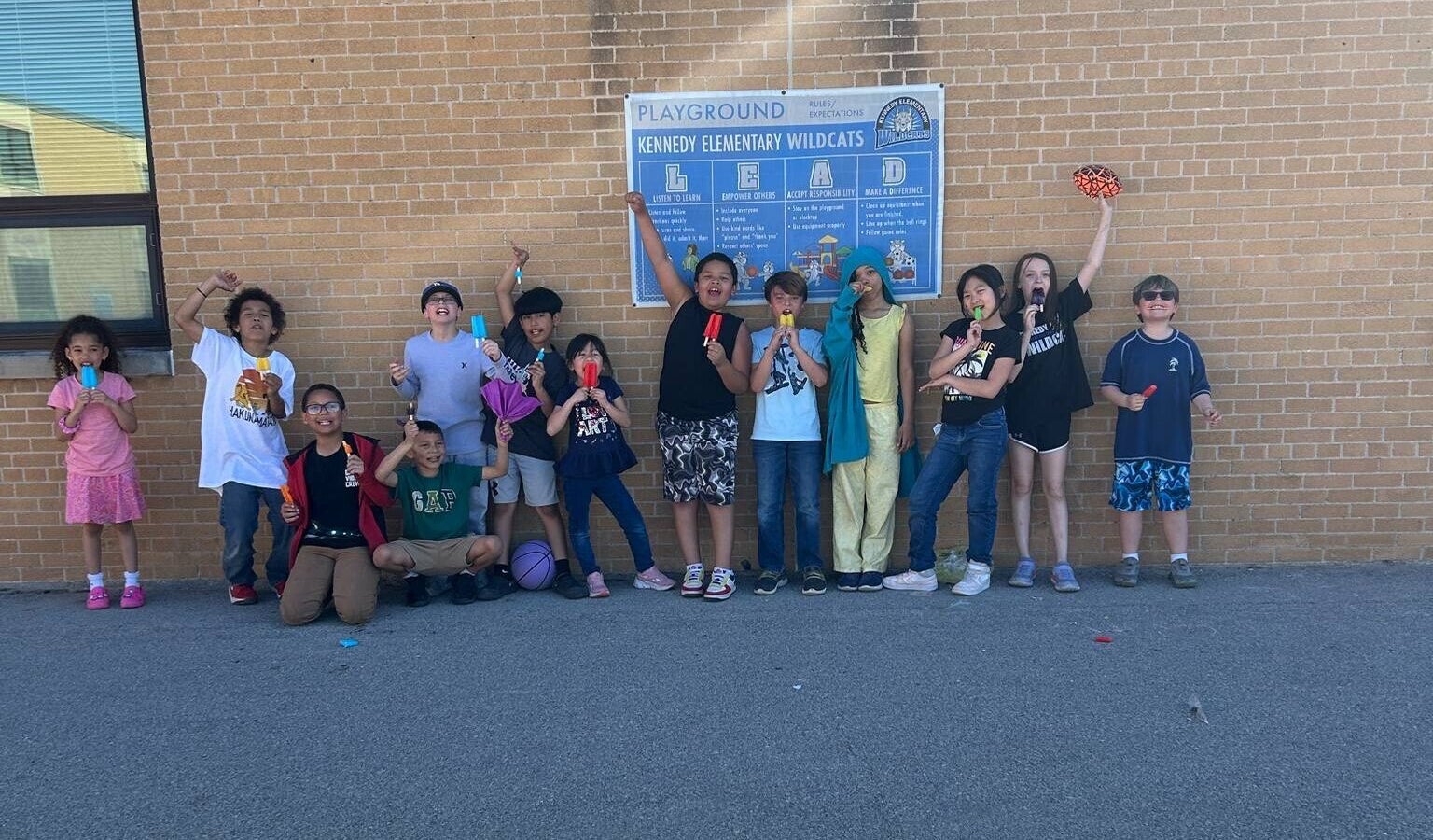 A group of kids posing for a photo.