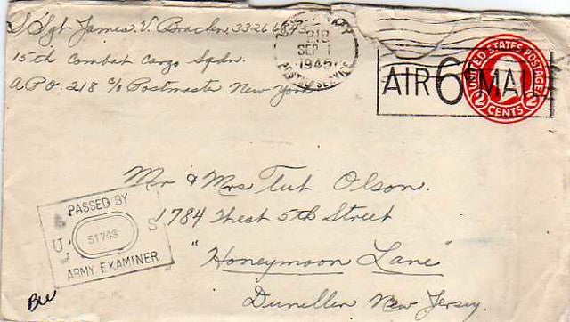 A vintage envelope postmarked 1945, addressed to Mr. & Mrs. Tut Olson in New Jersey, with military sender details and a red 6-cent air mail stamp.