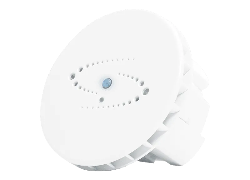 A white, round electronic device with a central button and perforations arranged in an oval pattern on its surface.