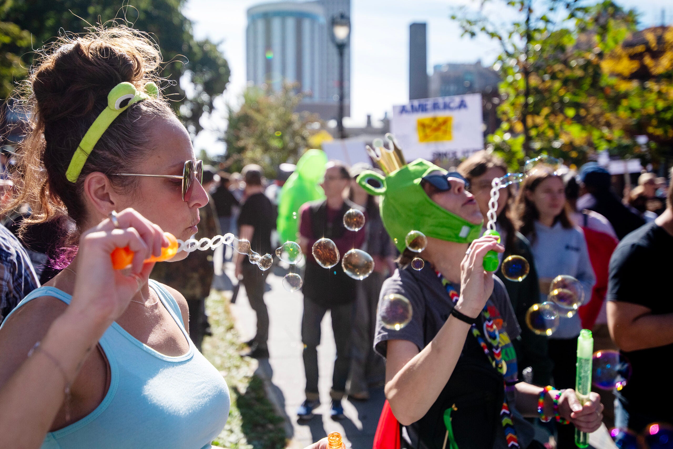 Wisconsinites protest Trump administration at ‘No Kings’ rallies — with signs and unicorn suits