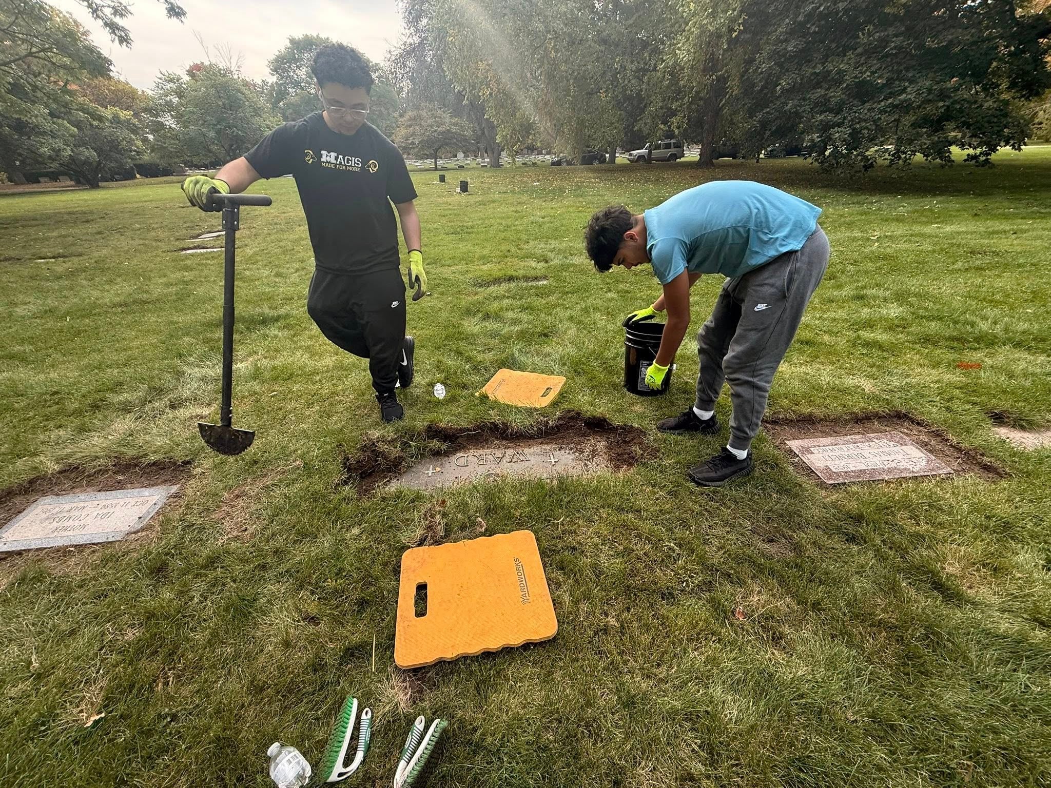 High school seniors explore history by restoring gravestones