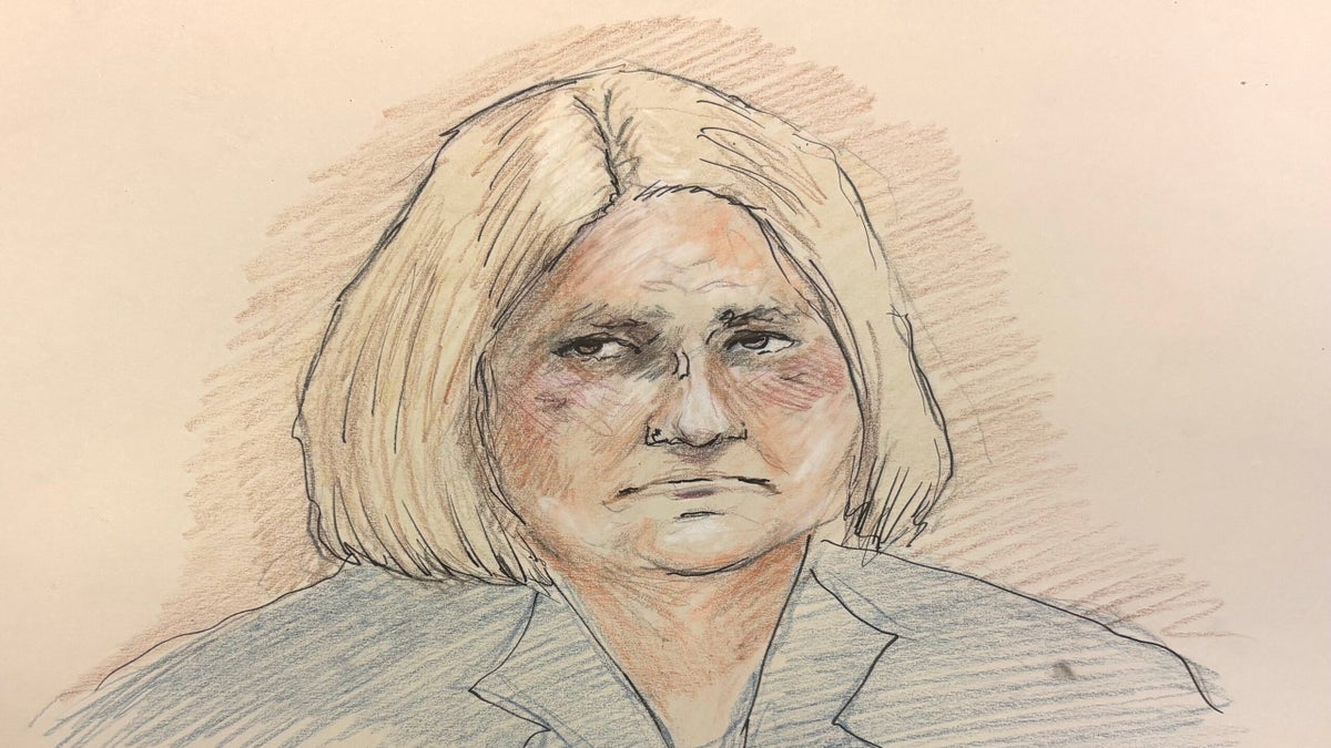 A pencil and colored pencil courtroom-style sketch of a person with shoulder-length blond hair, wearing a dark suit, looking forward with a neutral expression.
