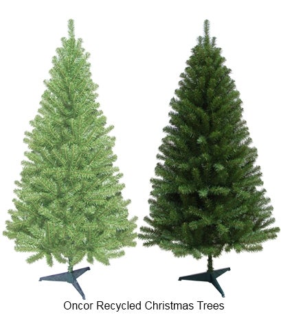 Two artificial Christmas trees with green branches on black metal stands, shown side by side against a white background.
